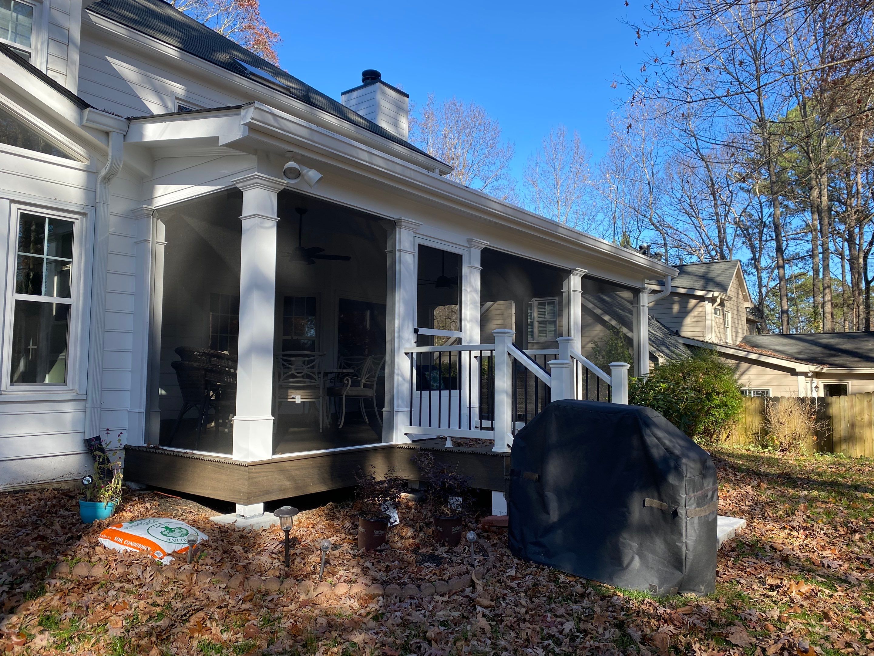Custom Screened Porch with Beadboard Ceiling and Composite Decking by Swift Home Renovations