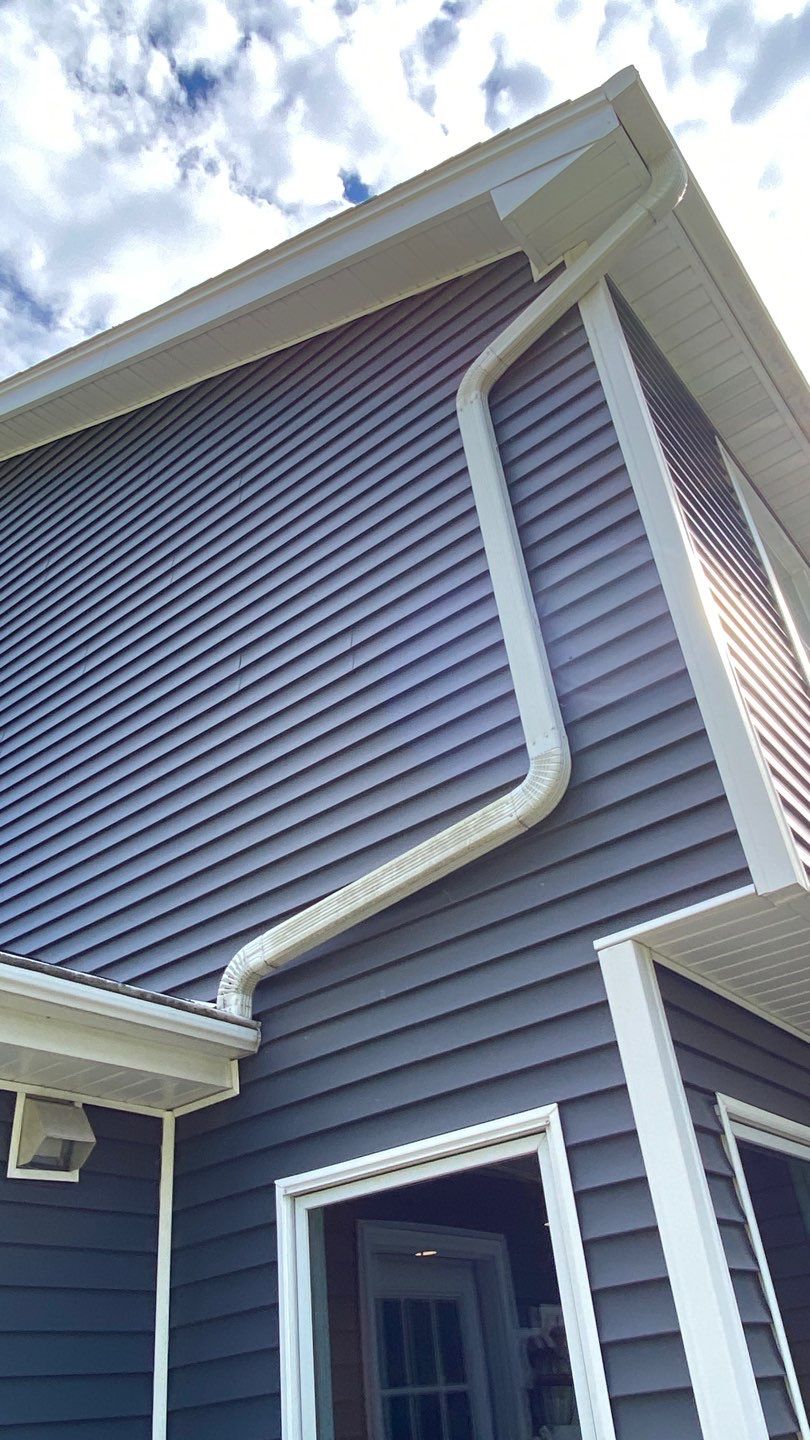 Asphalt Roof Replacement with Aluminum Gutter Installment by Custom Installations