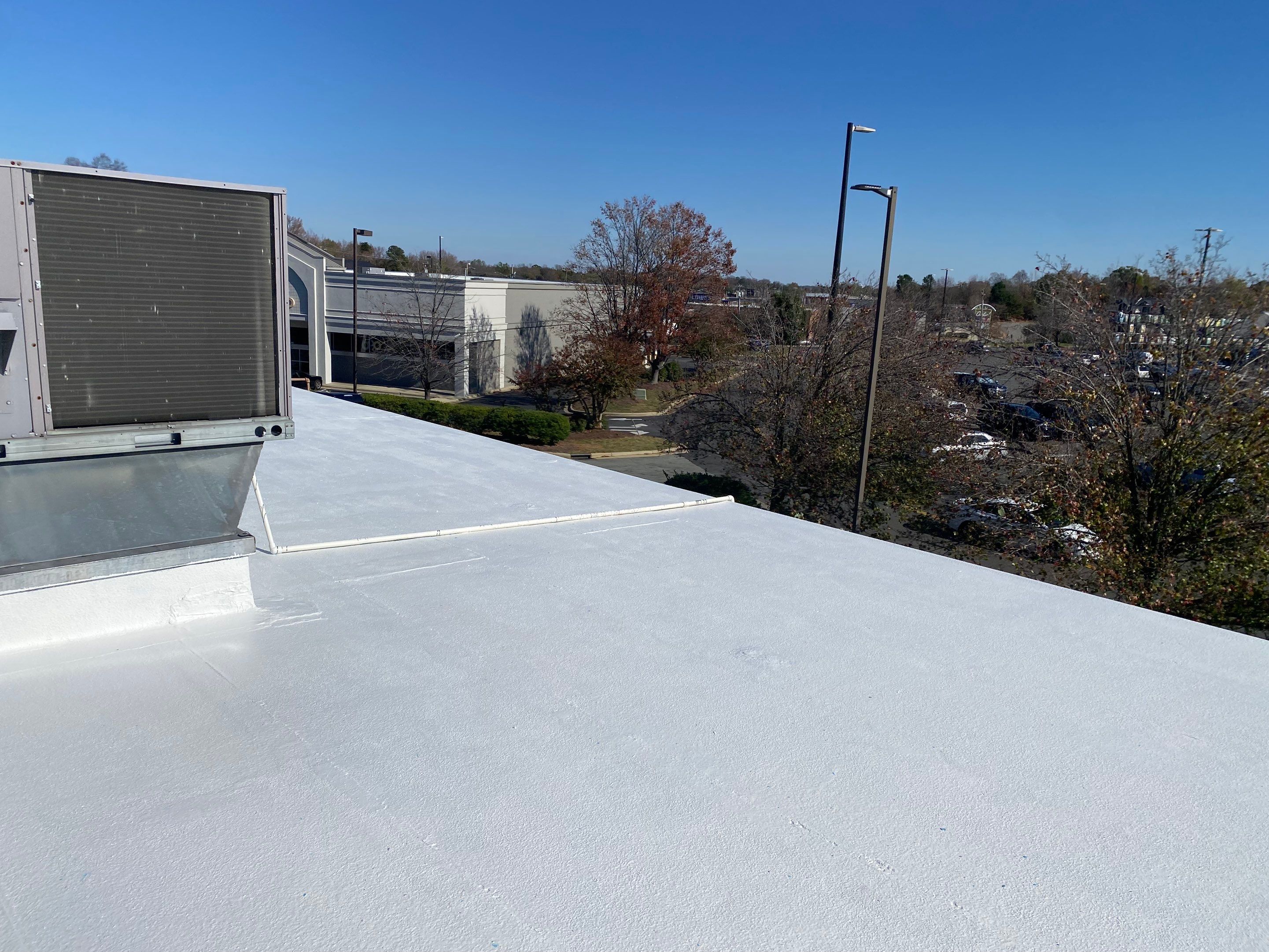 Commercial Coating using Poly Urerthane and Silicone Coating by Just In Time Roofing and Restoration