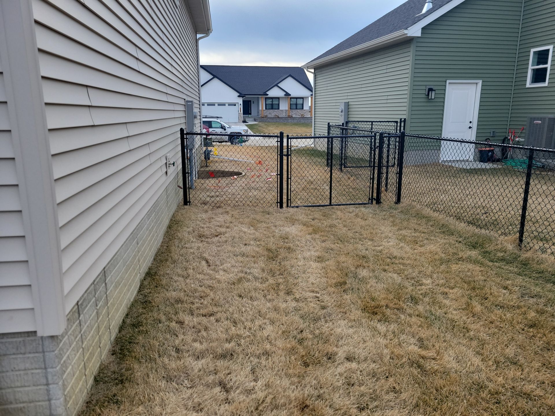 Black Chain Link Fence and Gate Installation in Cedar Falls by Perfect Picket Fence and Stain