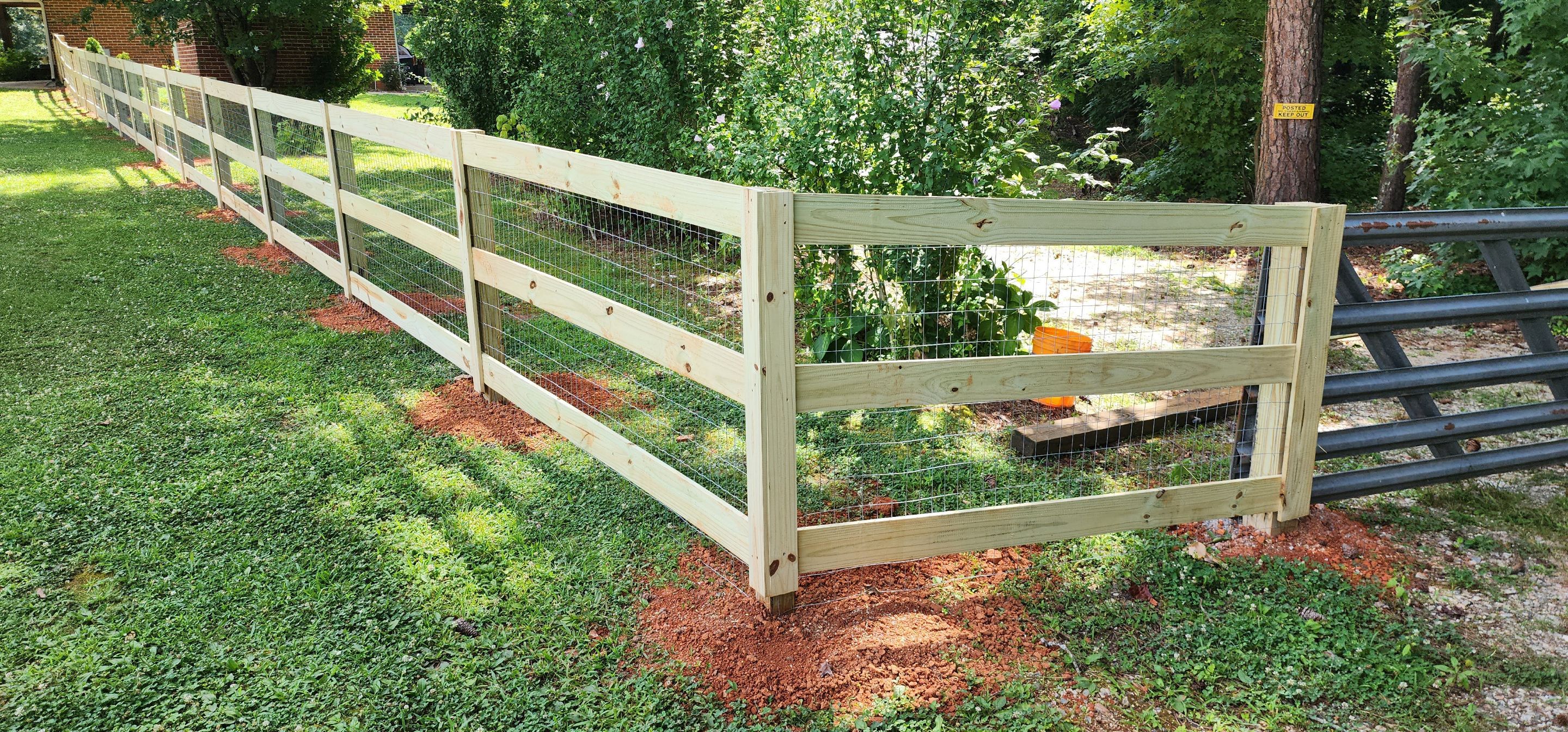 Fence Installation of 3 Rail Ranch with Wire Backing by Titans of Timber Fence & Stain