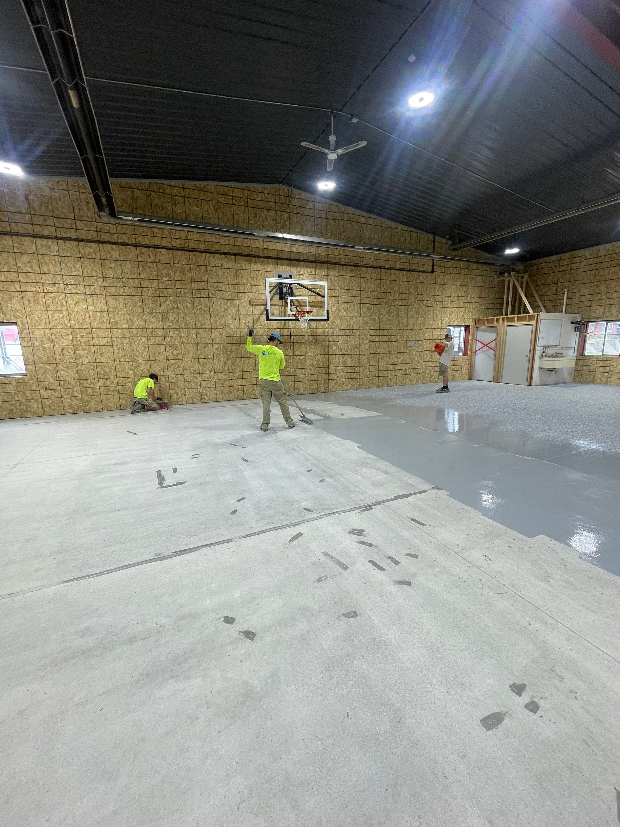 Custom Polyurea Shop Floor with Basketball Court Lines in Rock Valley by Select Painting, Coatings & Garage Cabinets