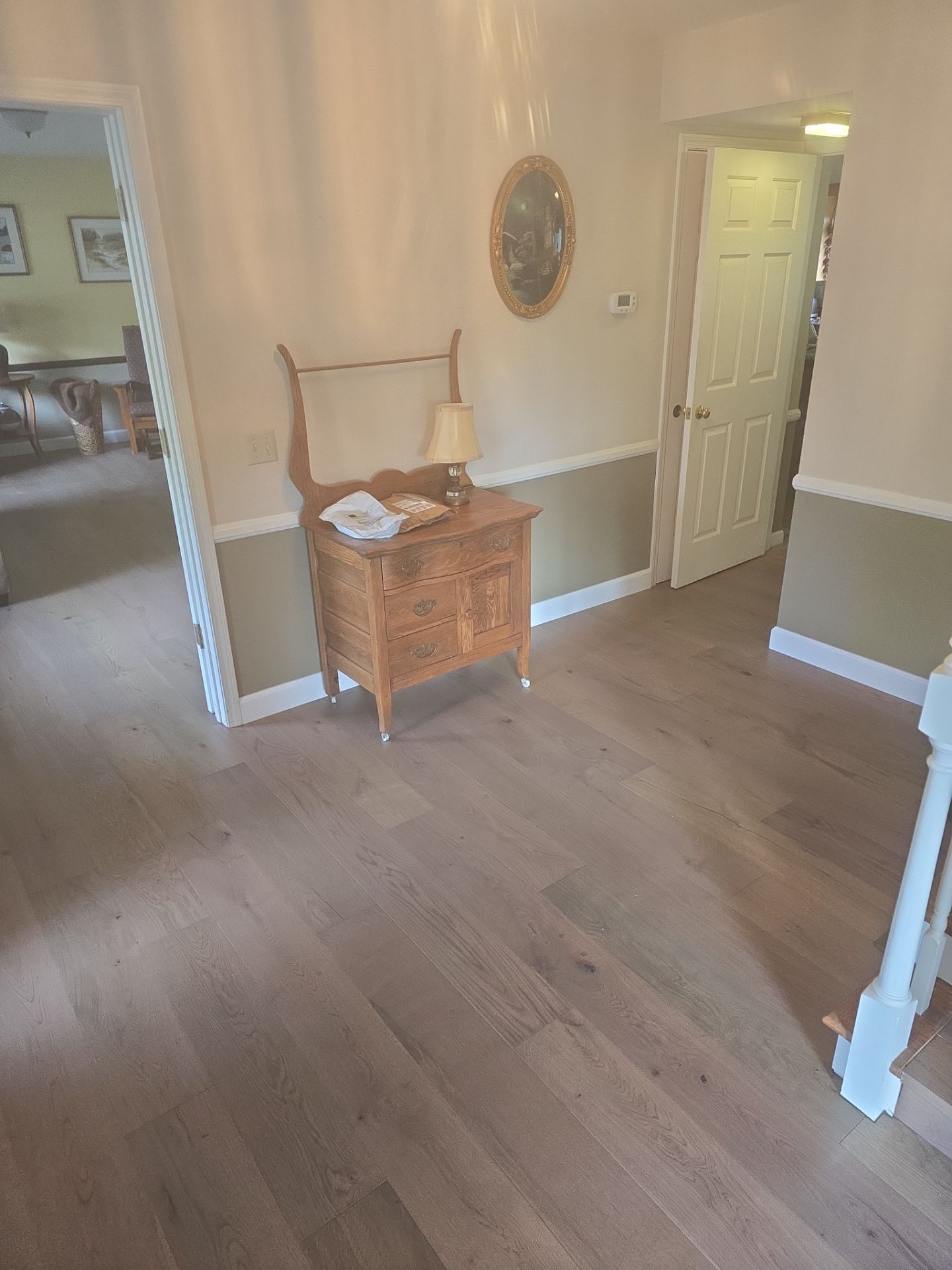 Engineered Wood Flooring Installation and Staircase Upgrade in Brookings by KMD Surfaces INC.
