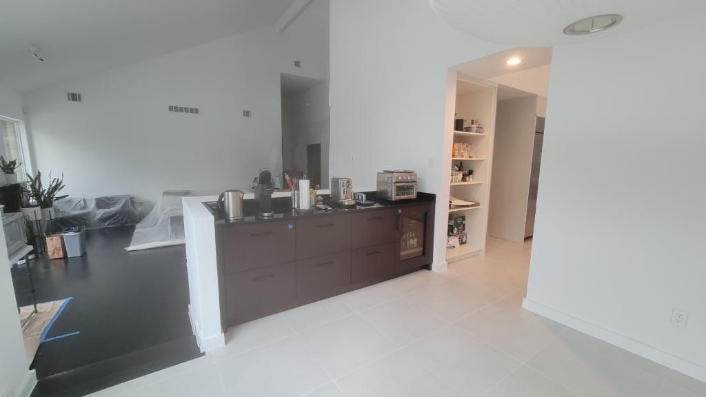 Modern & Clean Kitchen by SLM General Contractors & Roofing