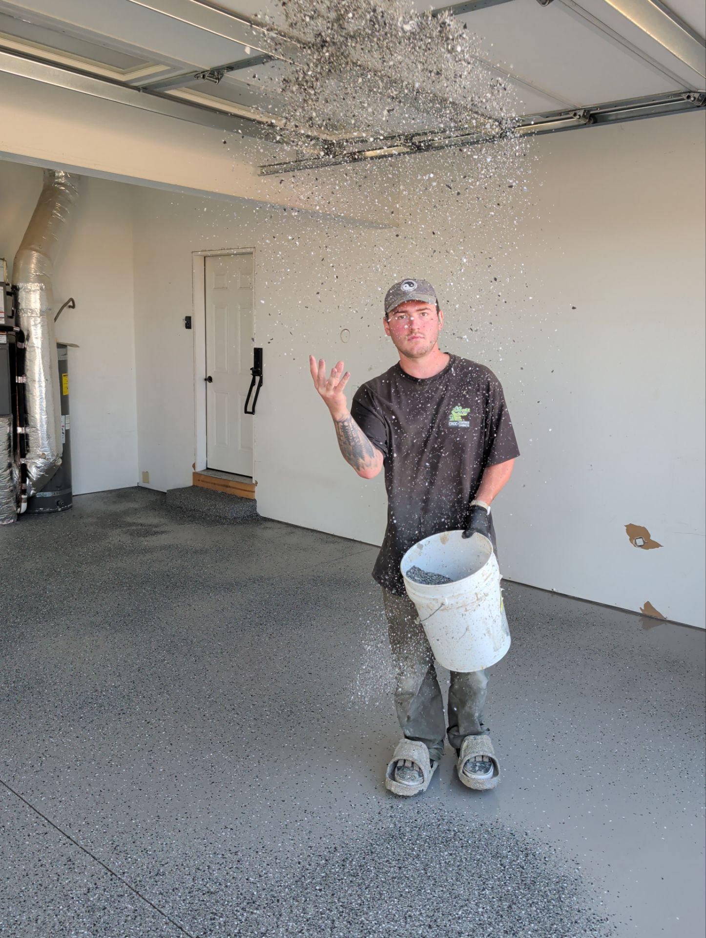 Polyaspartic Garage Floor Coating With Slate Hybrid Flake in Davenport by Croc Coatings, LLC