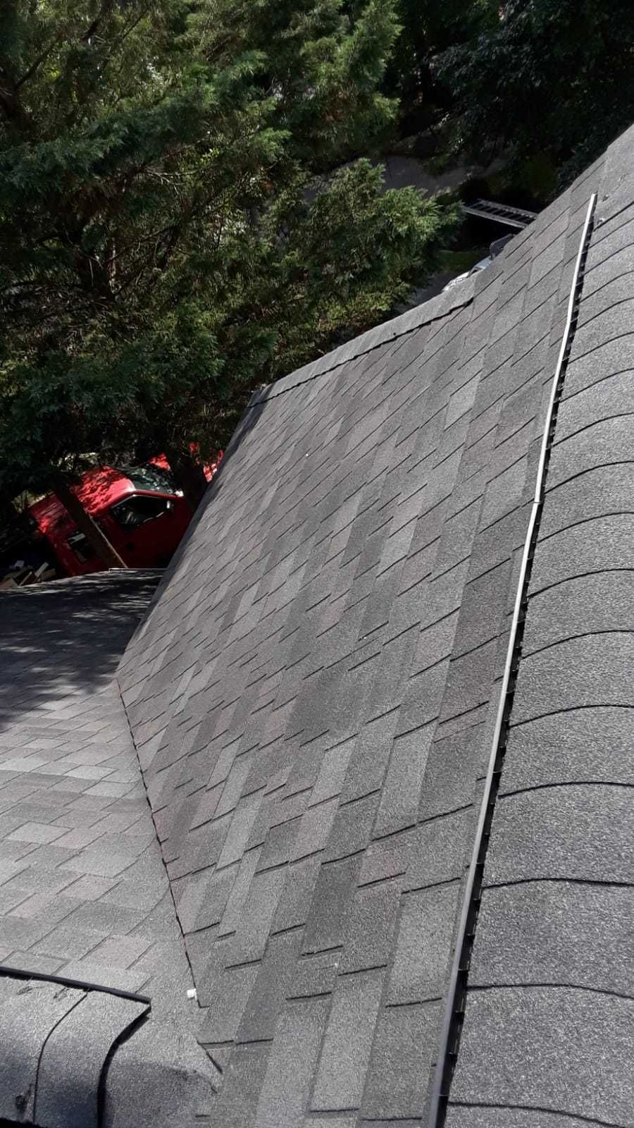 Skylight, Roof, and Gutter Replacement by American Home Contractors