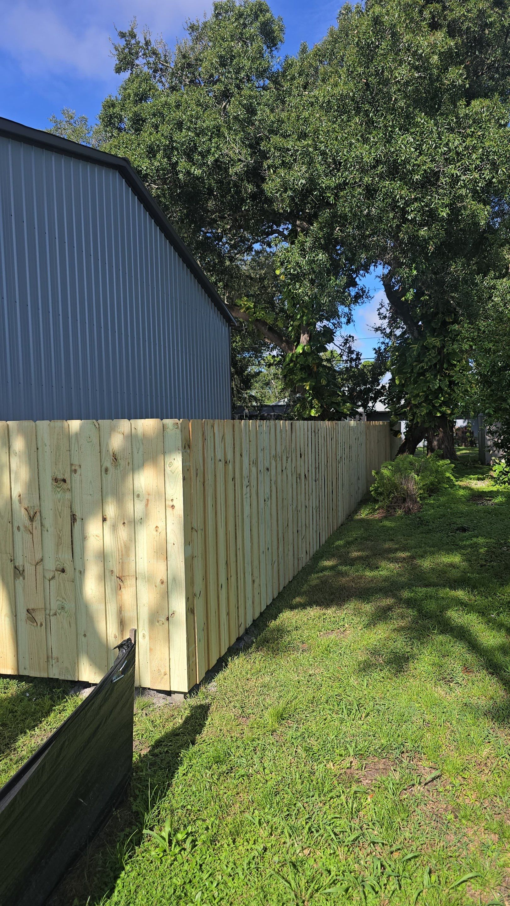 Pressure-Treated Wood Privacy Fence and Gate Installation in North Port by True Fence LLC