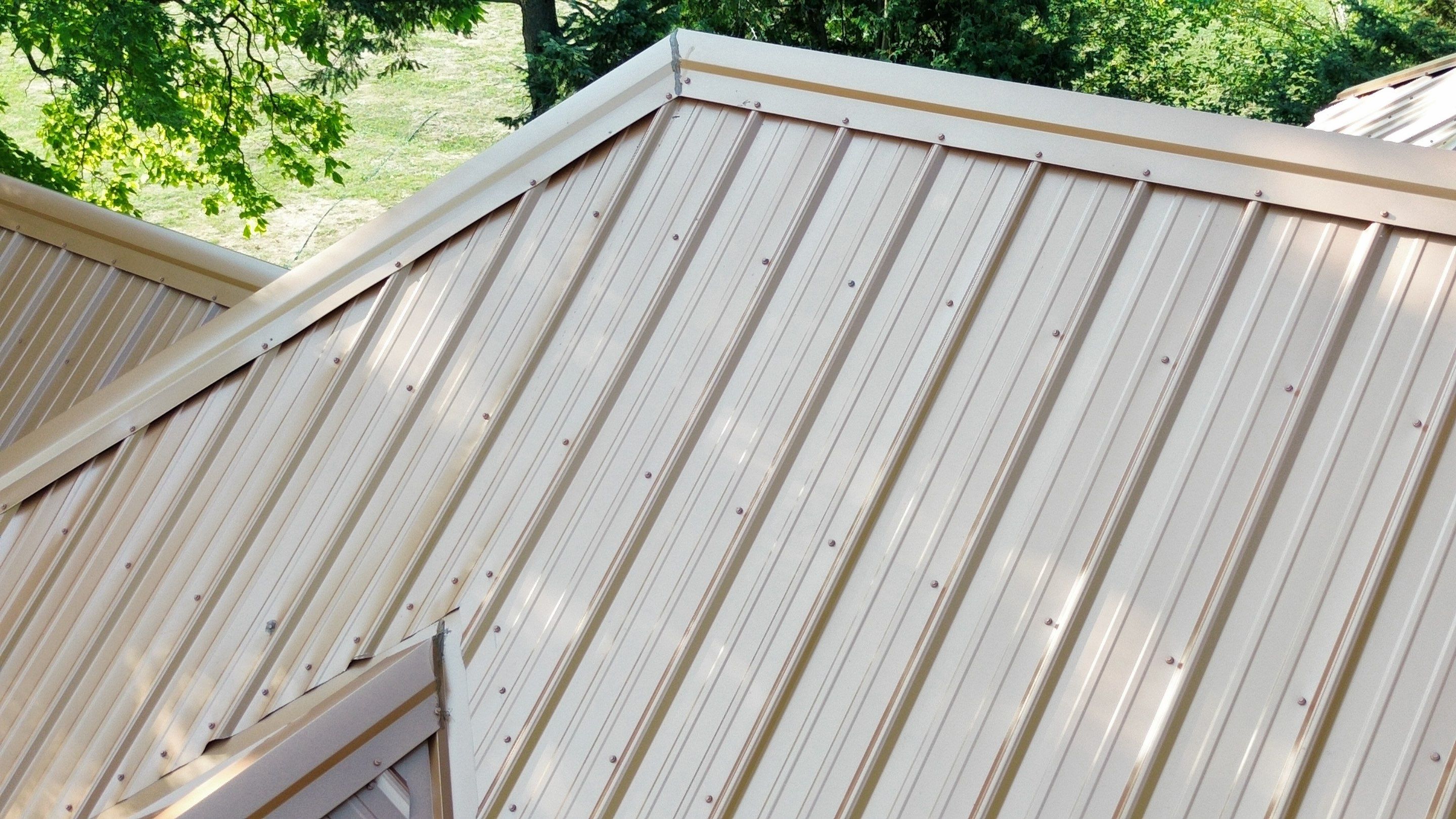 Residential Roofing Installation using Performance Panel Metal - Copper Metallic by RoofX 