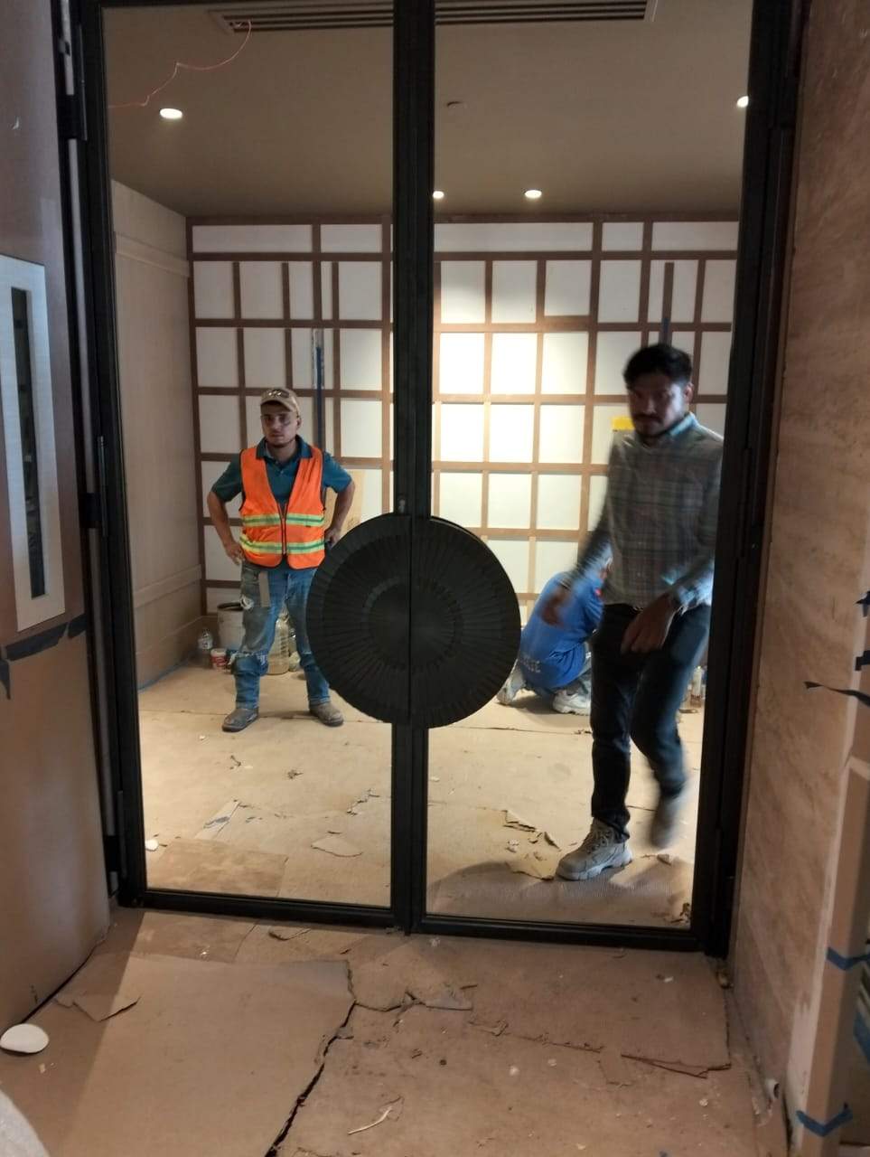 Modern Black Frame Double Door Installation with Custom Radial Hardware by Solara Custom Living