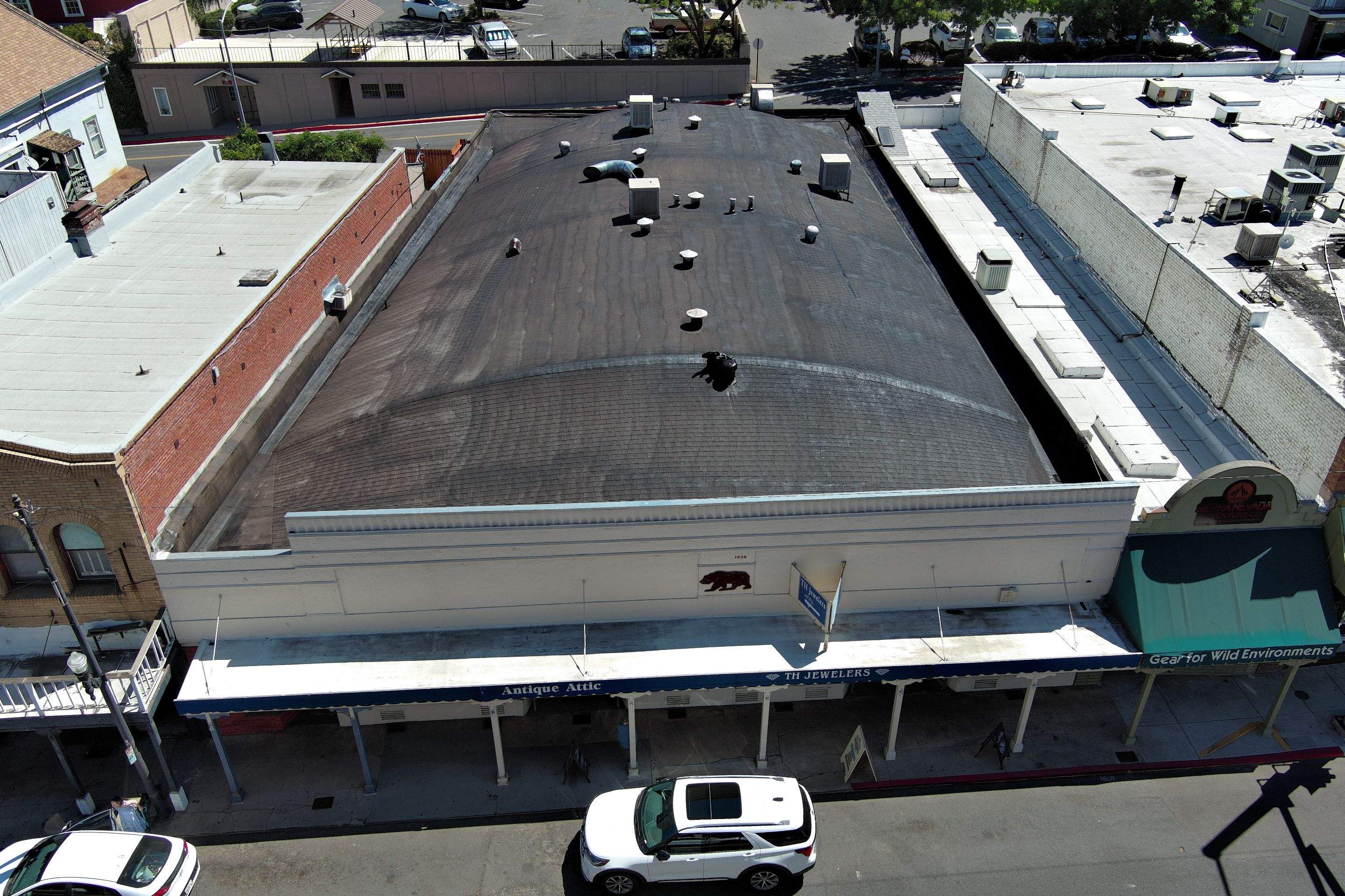Foam and coatings on commercial roof by Straight Edge Roofing Inc