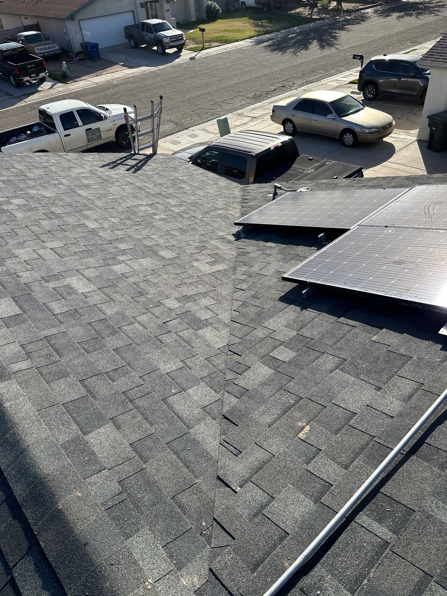 Charcoal Shingles by Reimagine Roofing