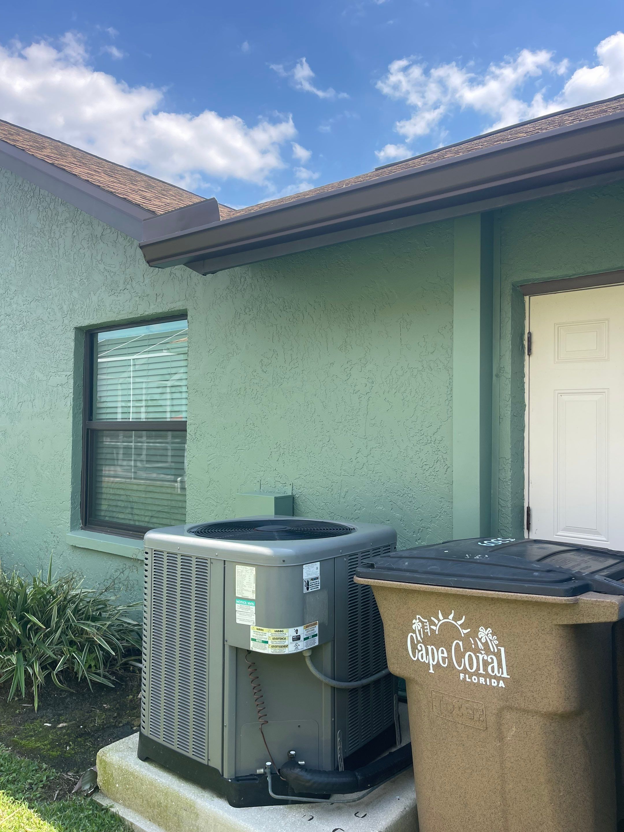Musket Brown Seamless Gutter Installation Before Rainy Season in Cape Coral FL by Gutter Professors