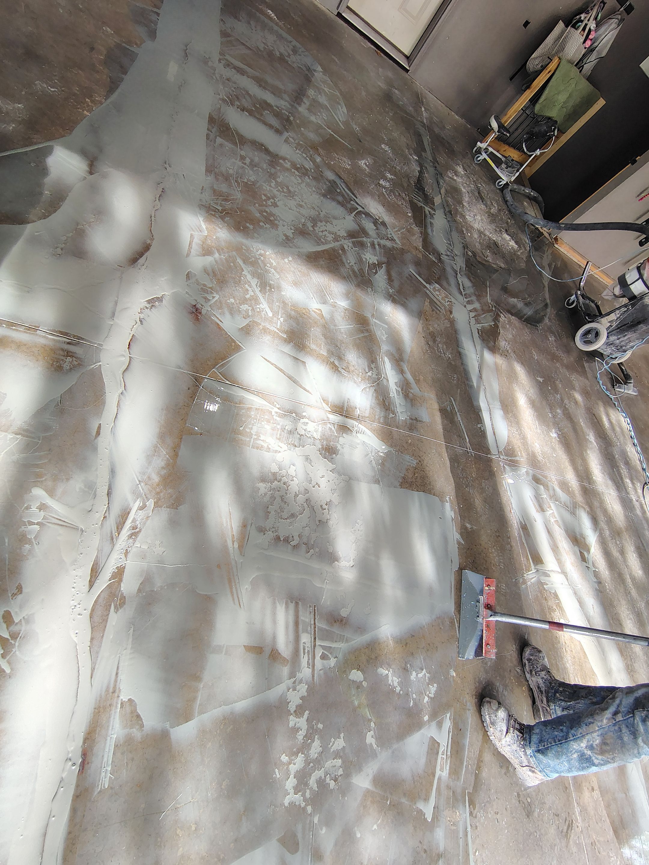 Garage Floor Concrete Coating and Crack Repair in Sioux Falls by Select Painting, Coatings & Garage Cabinets