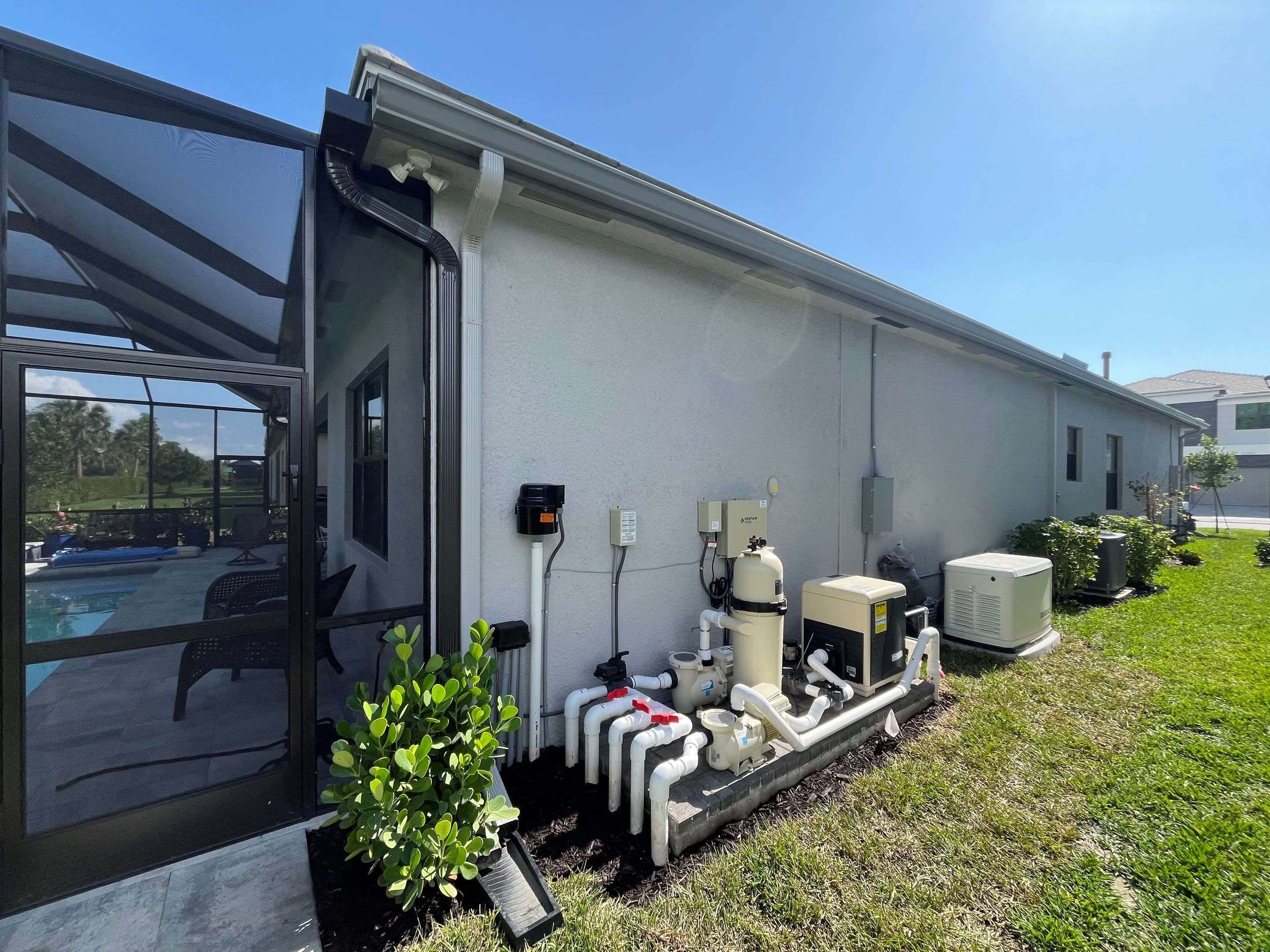 Grey Seamless Gutter Installation in Estero FL by Gutter Professors