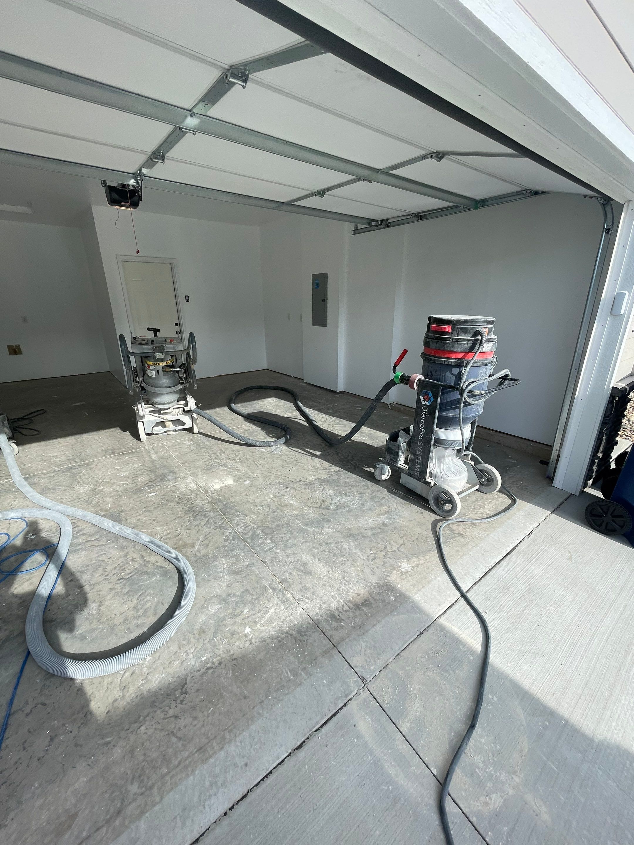 Sioux Falls Garage Floor Transformation with Cabin Fever Decorative Chips by Select Painting, Coatings & Garage Cabinets