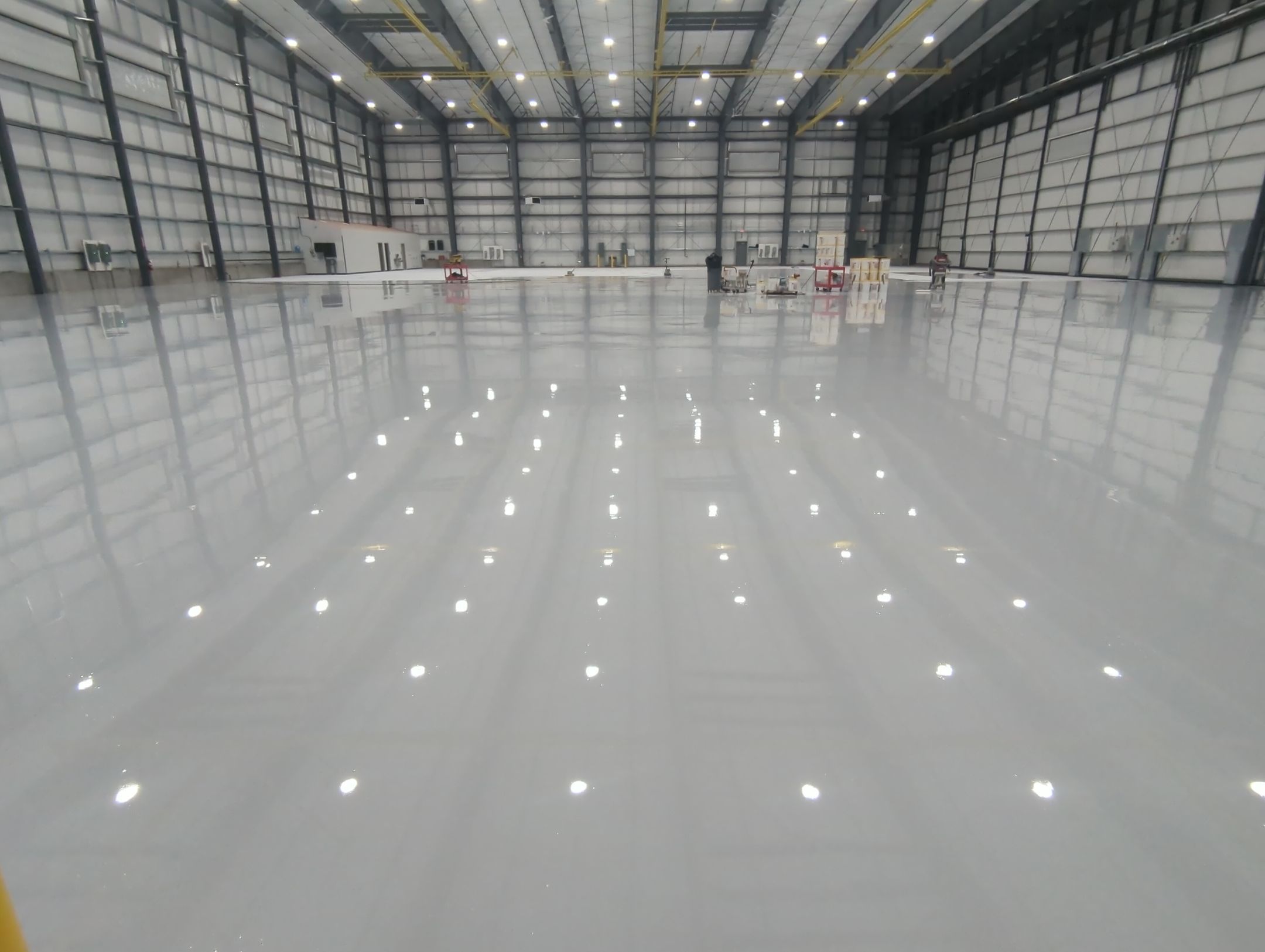 Airplane Hanger using Light Grey Commercial Penntek Epoxy by Croc Coatings, LLC