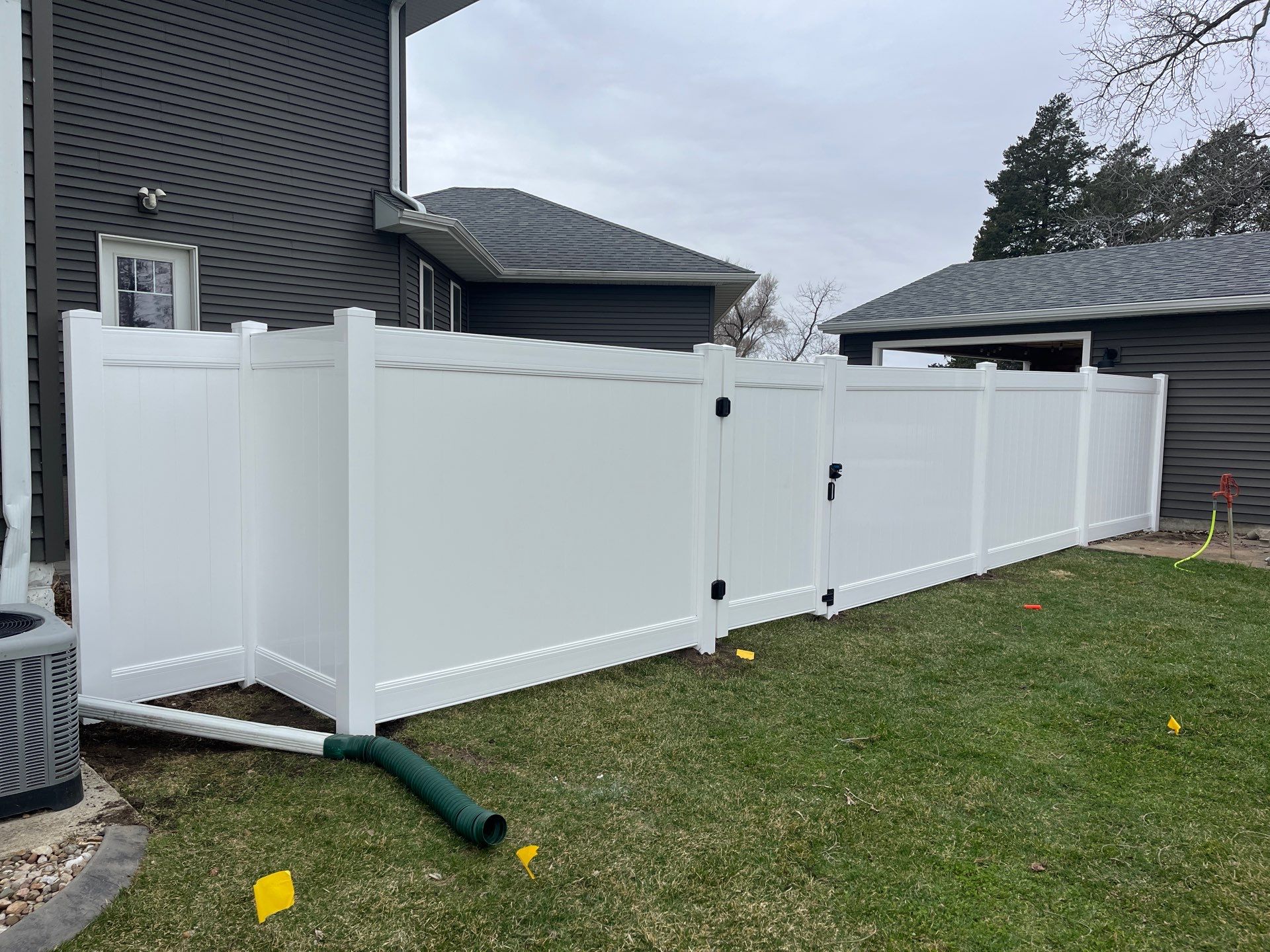 White Vinyl Privacy and Black Chain Link Fencing in Buckingham by Perfect Picket Fence and Stain