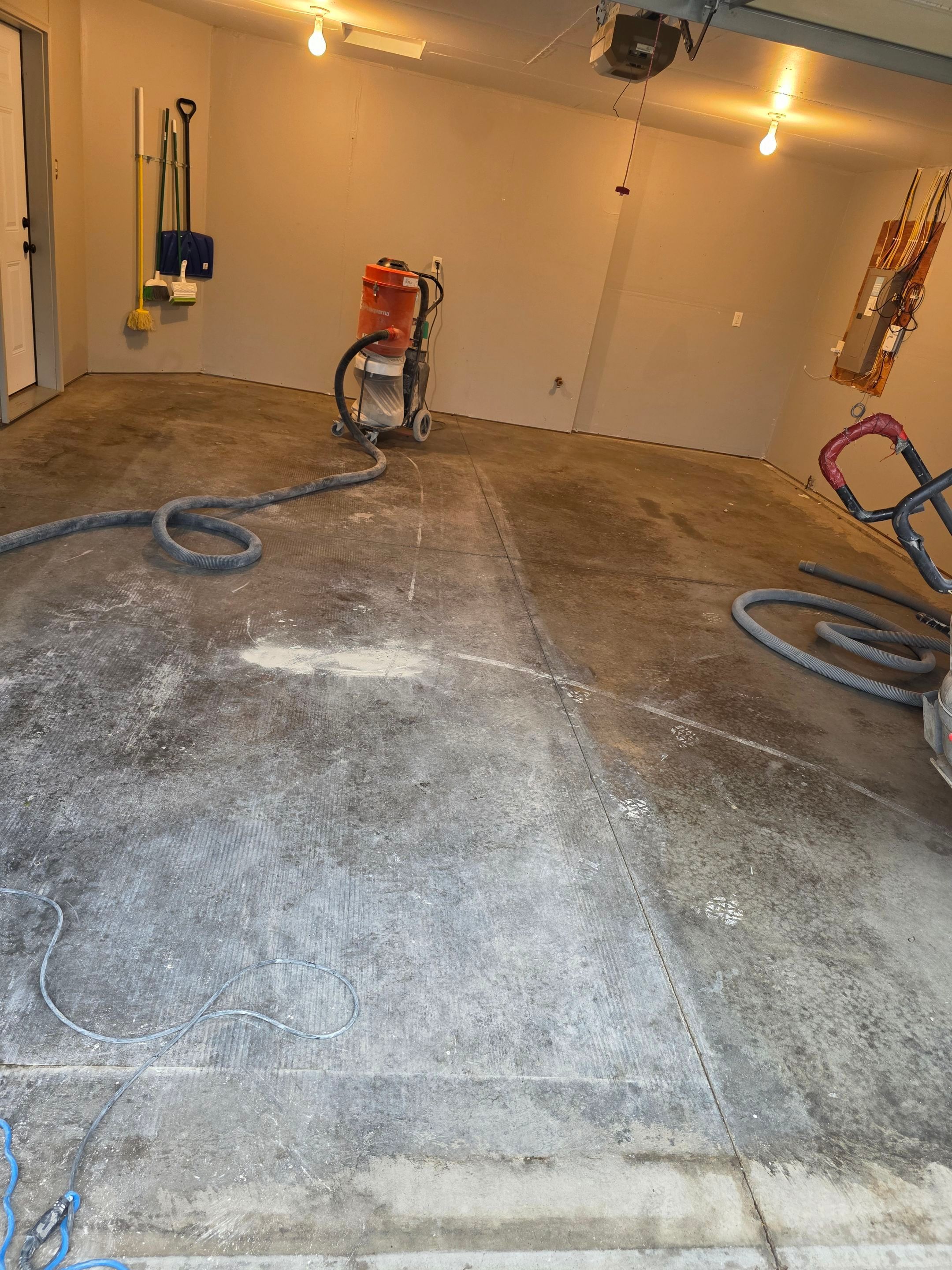 Custom Polyurea Flake Garage Floor Installation in Sioux Falls by Select Painting, Coatings & Garage Cabinets