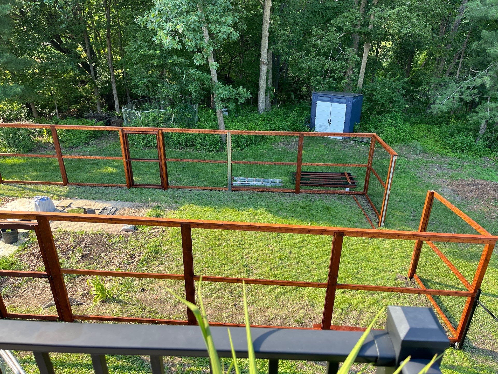 Stained Cedar Mahogany Garden Fence and Raised Bed Enclosure in Cedar Falls by Perfect Picket Fence and Stain