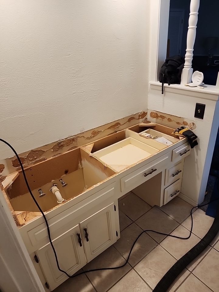 New shower, flooring, and countertop by The Shower Company