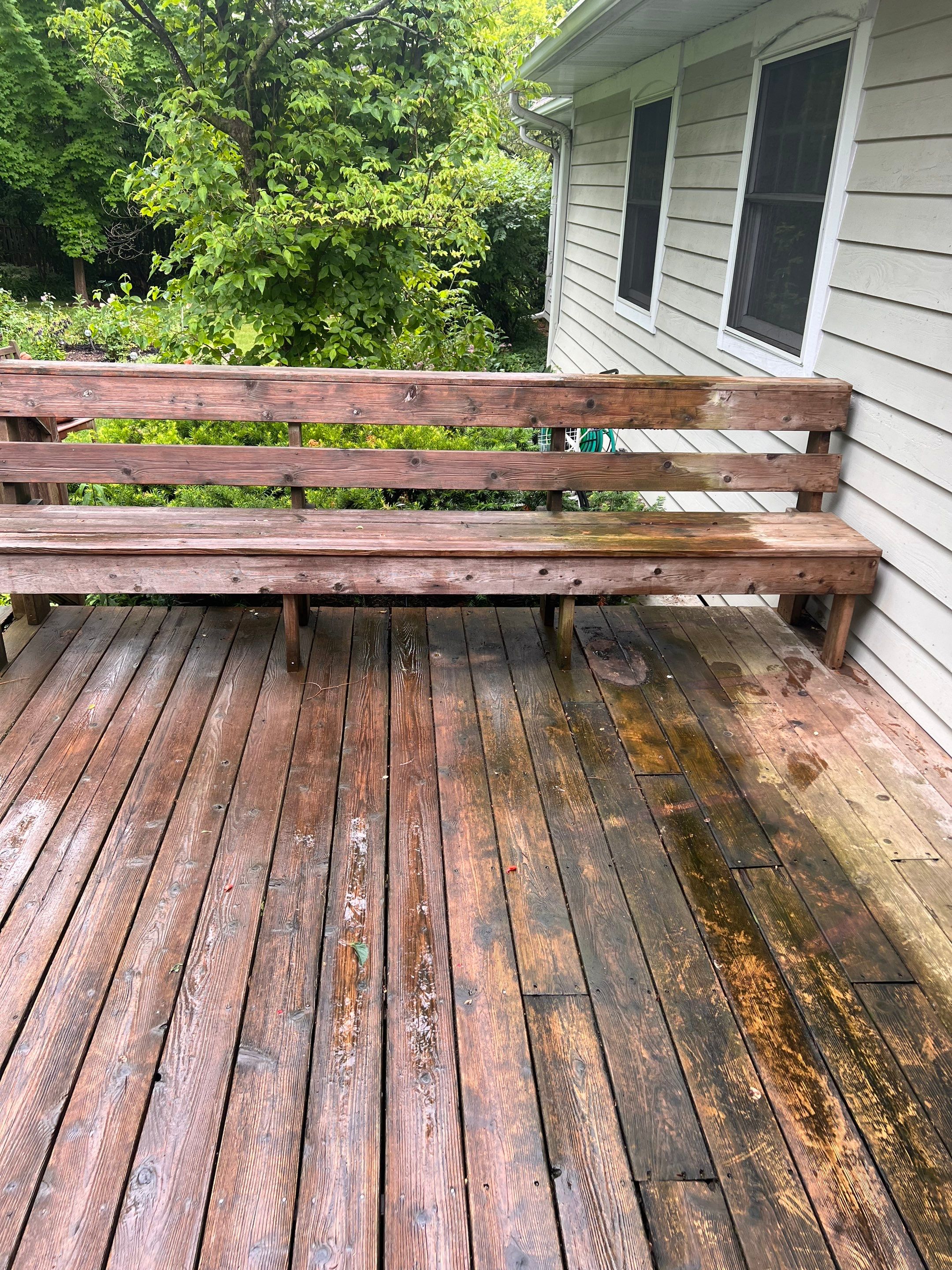 Wood deck cleaning, board replacement and staining by Northern Power Washing LLC.