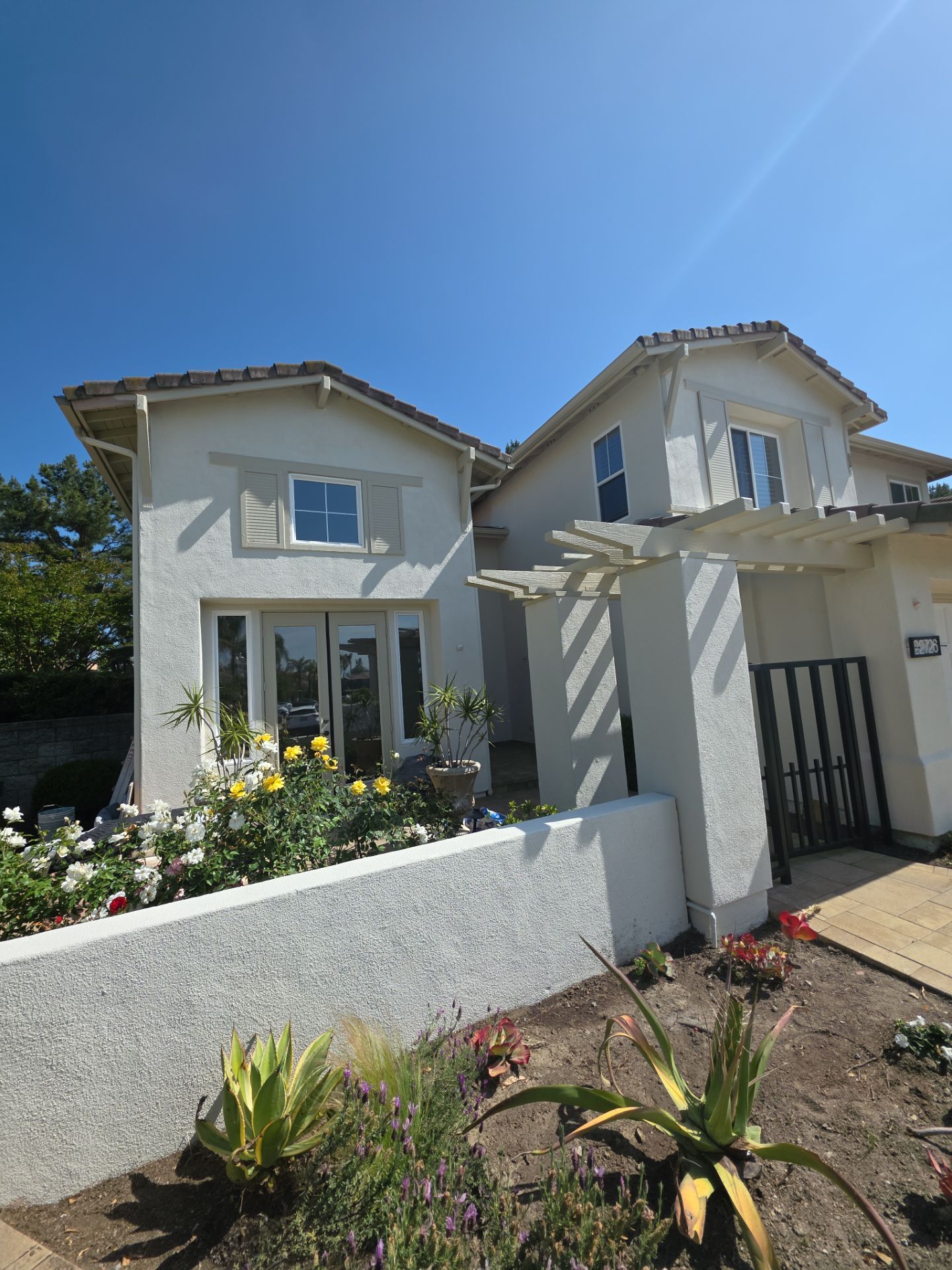 Exterior painting of this newly remodeled Mission Viejo home. by Beach City Painting