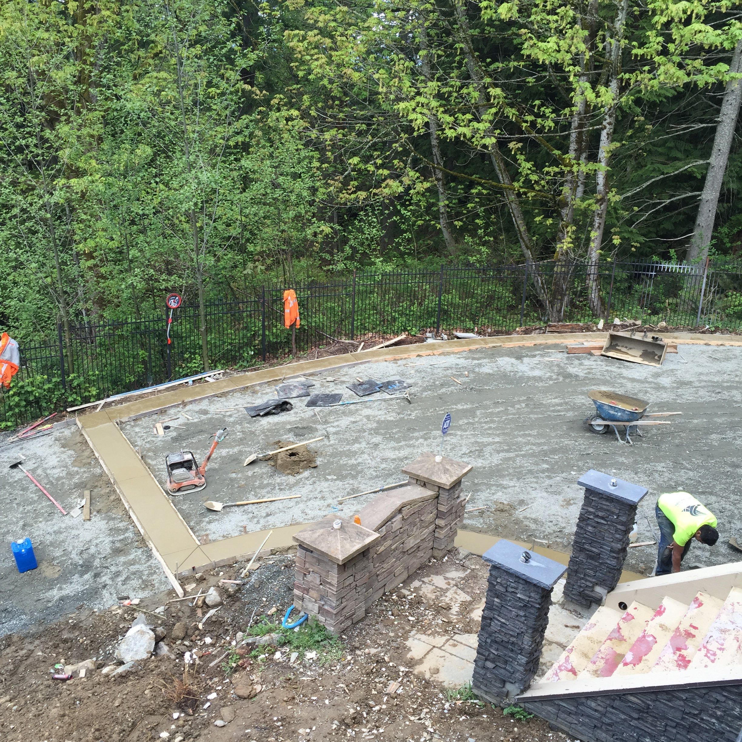 Asphalt Driveway and Stamped Concrete Patio Finish  by Jireh Asphalt & Concrete Inc 