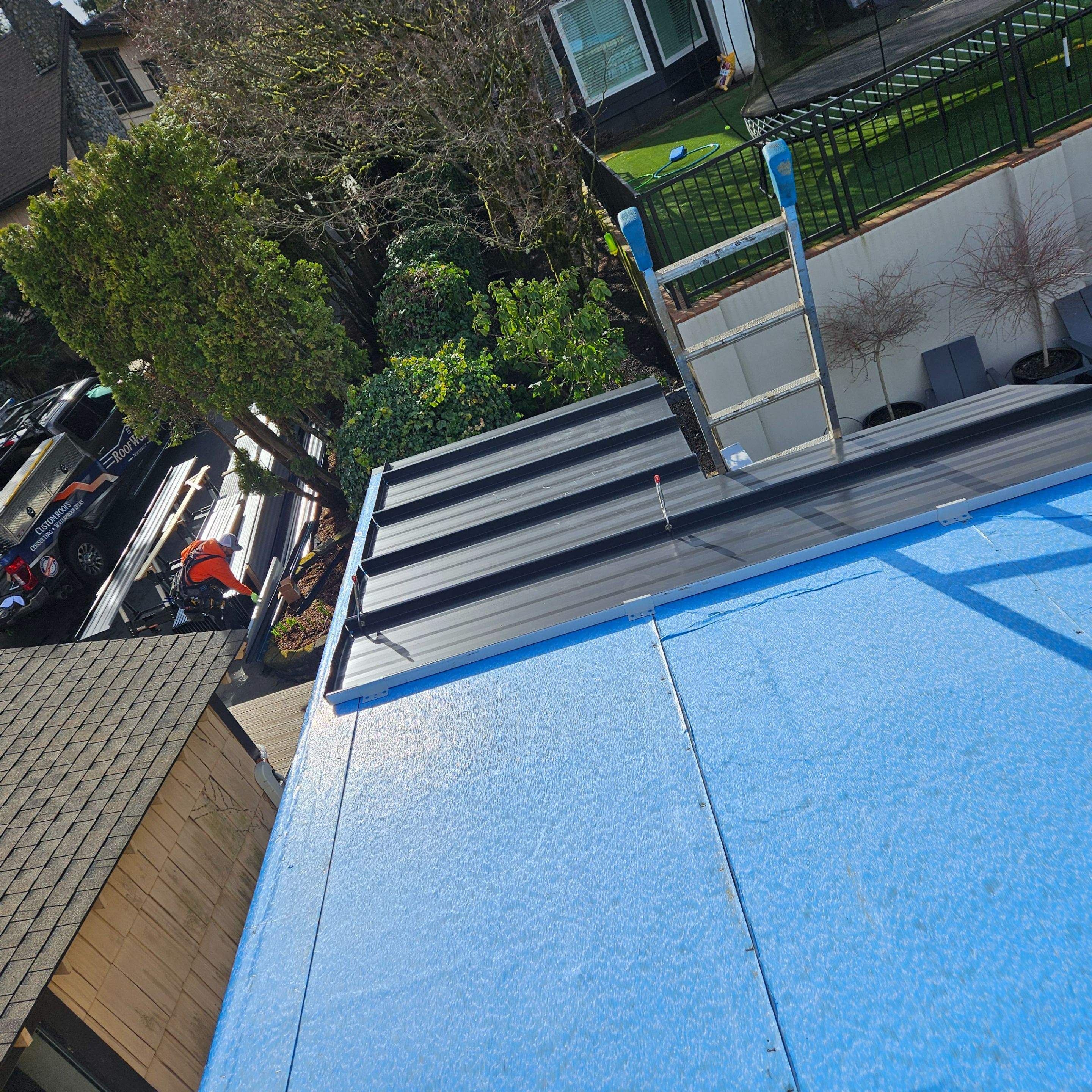 Boathouse roof and paint by RoofWorks Northwest