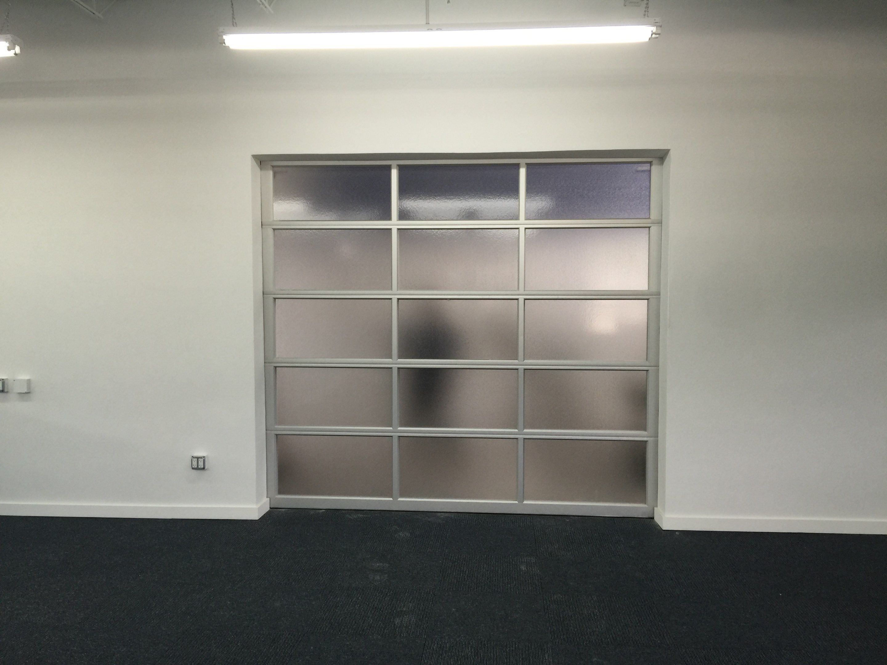 Clopay Avante, Aluminum and Glass Garage Door in Fort Lauderdale by The Door Doctor of South Florida, Inc.