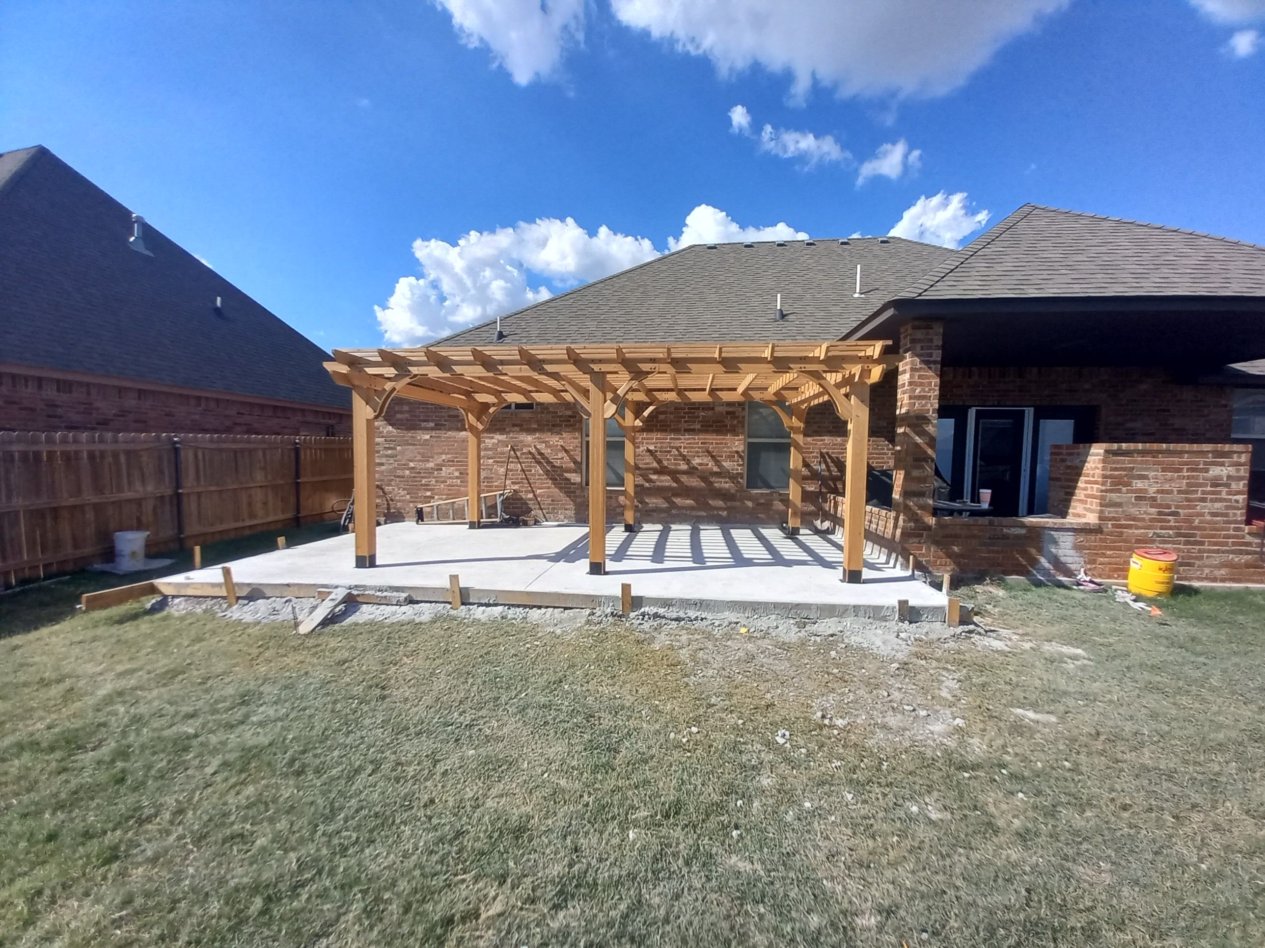 Concrete slab with Pergola by Clays Services Inc