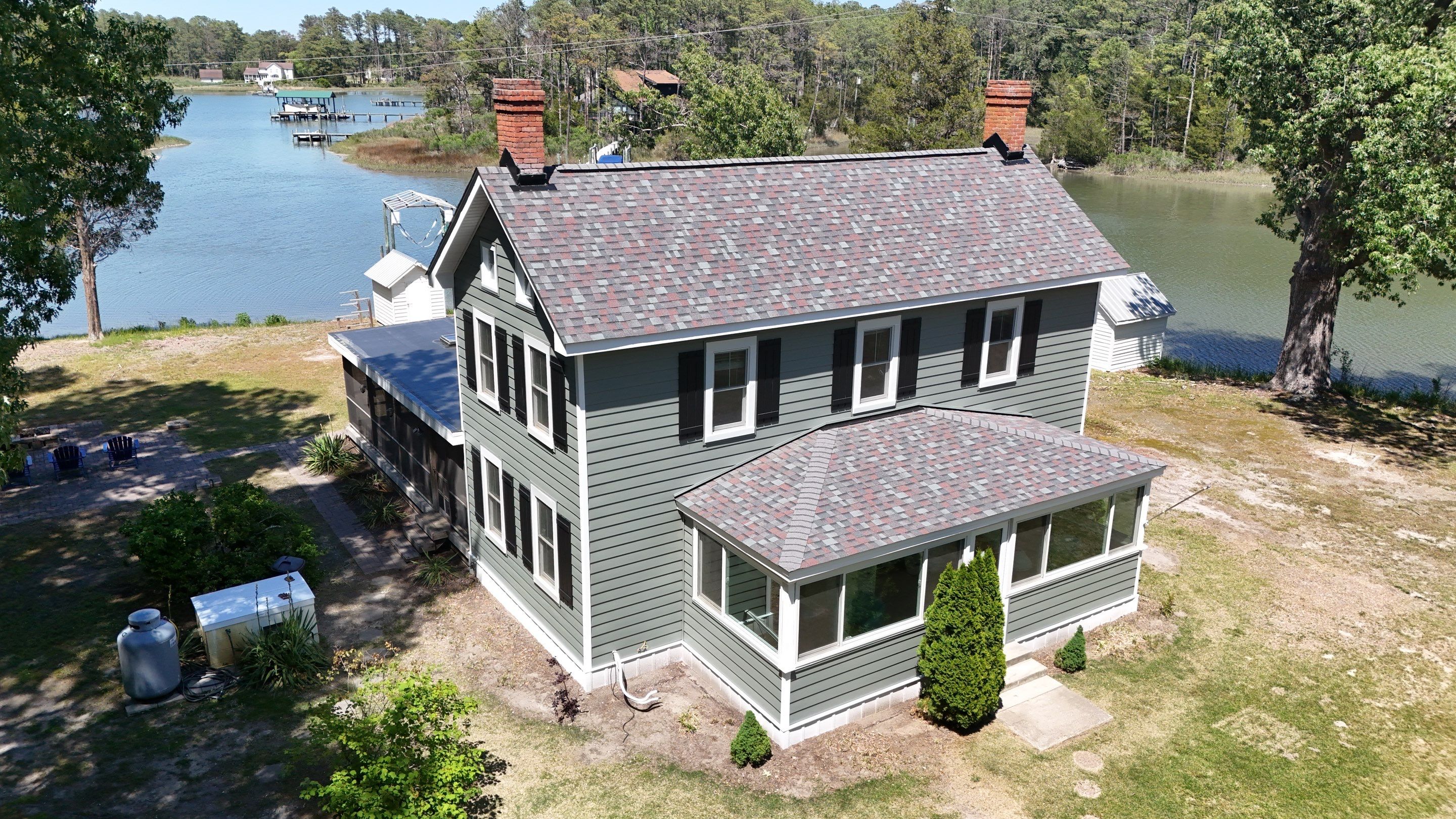 Waterfront Exterior Renovation in Port Haywood by Cade Construction