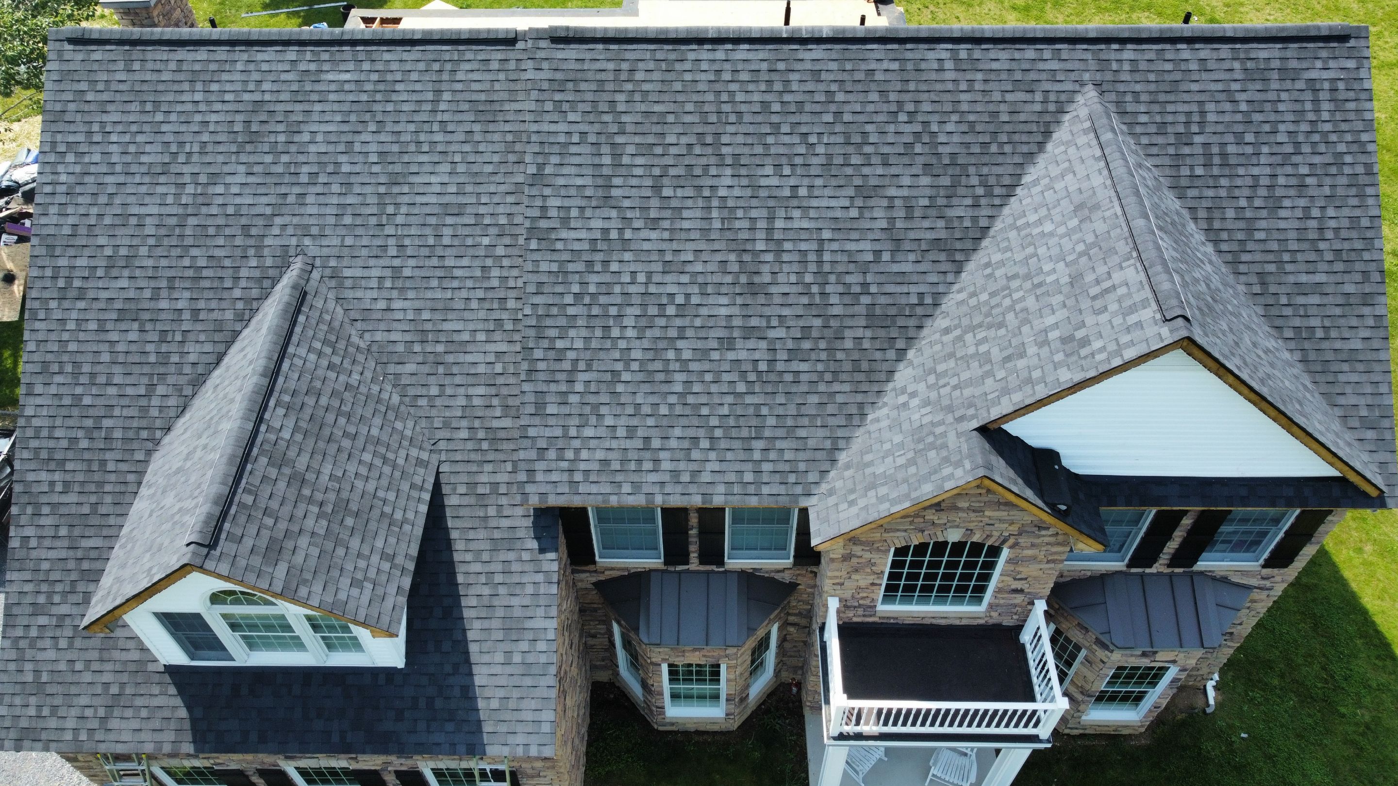 Roof Damage using Certainteed Lifetime Roofing System- Moire Black Landmark Pro shingkes with shadow ridge caps. by BulletpROOF Exteriors