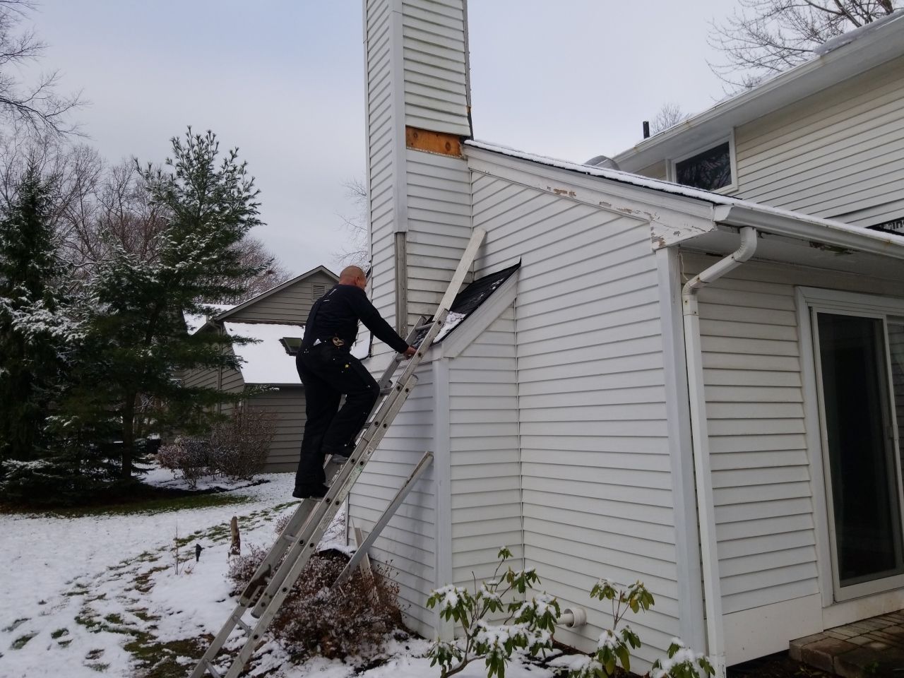 James Hardie Siding  using James Hardie Board and Batten, White by Absolute Roofing and Construction
