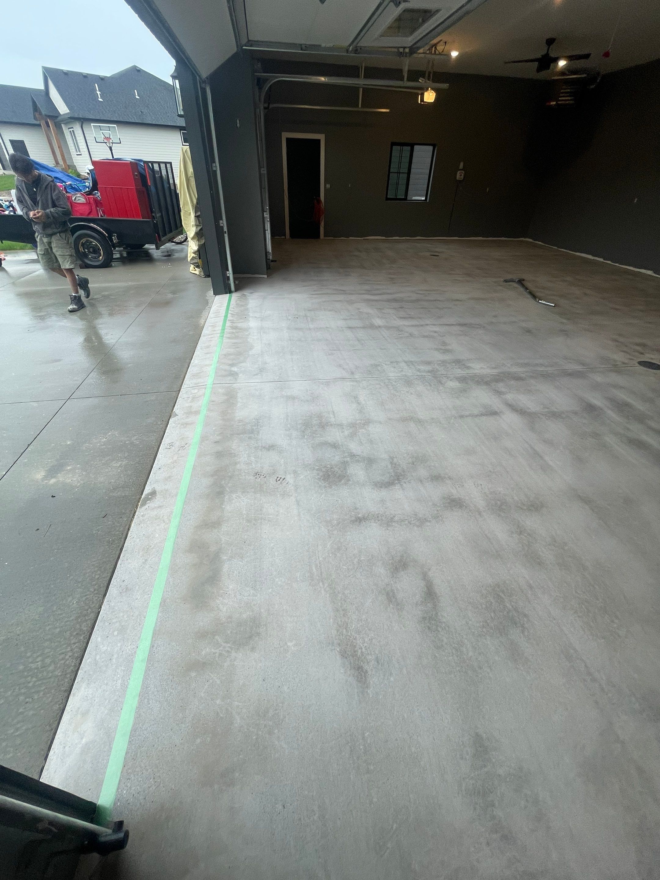 Custom Speckled Concrete Coating for Dell Rapids Garage by Select Painting, Coatings & Garage Cabinets