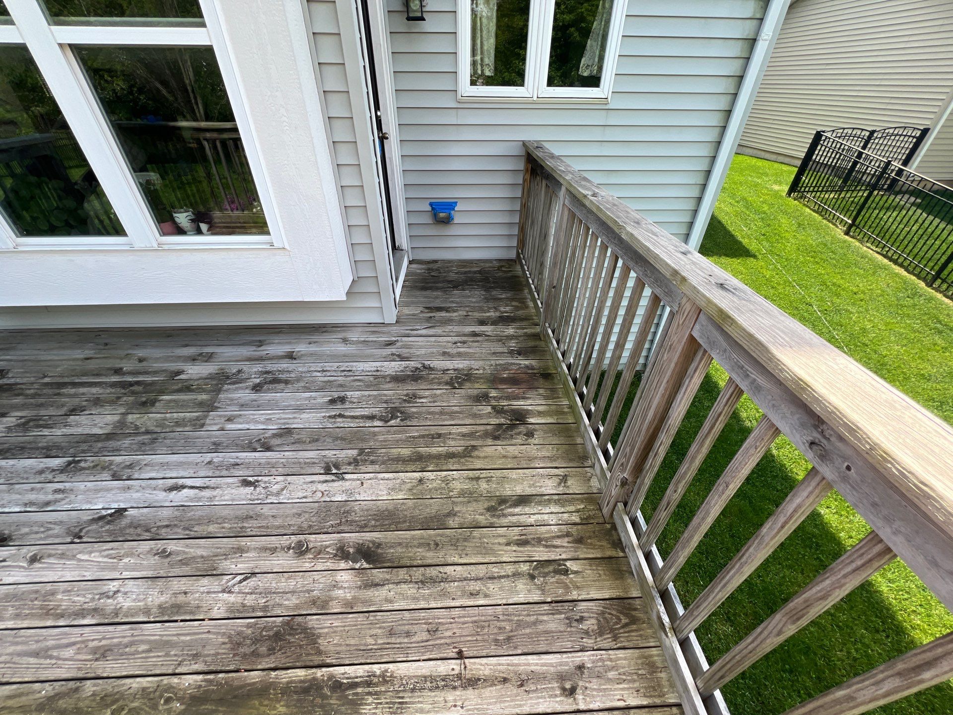 wood deck cleaning and staining by Northern Power Washing LLC.