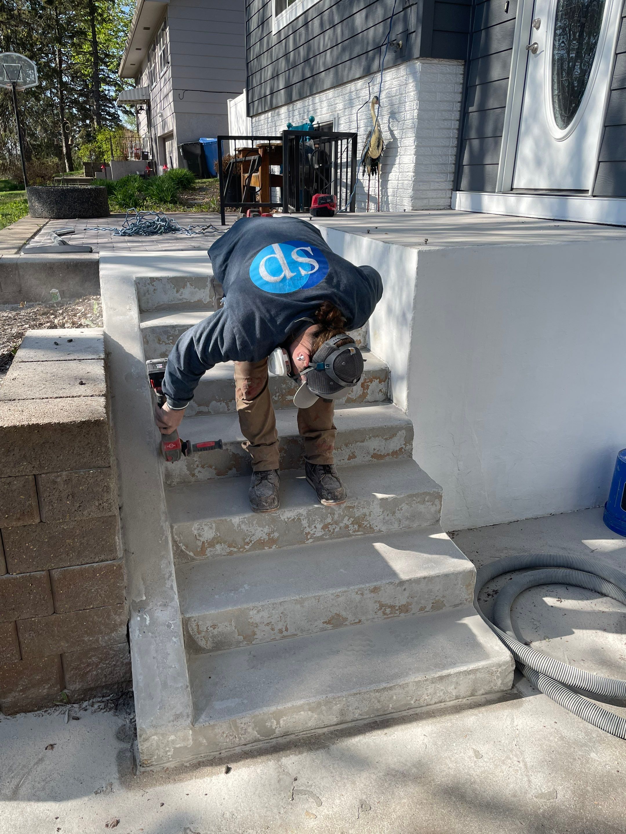 Grey Polyaspartic Porch and Stair Resurfacing in Sioux Falls by Select Painting, Coatings & Garage Cabinets
