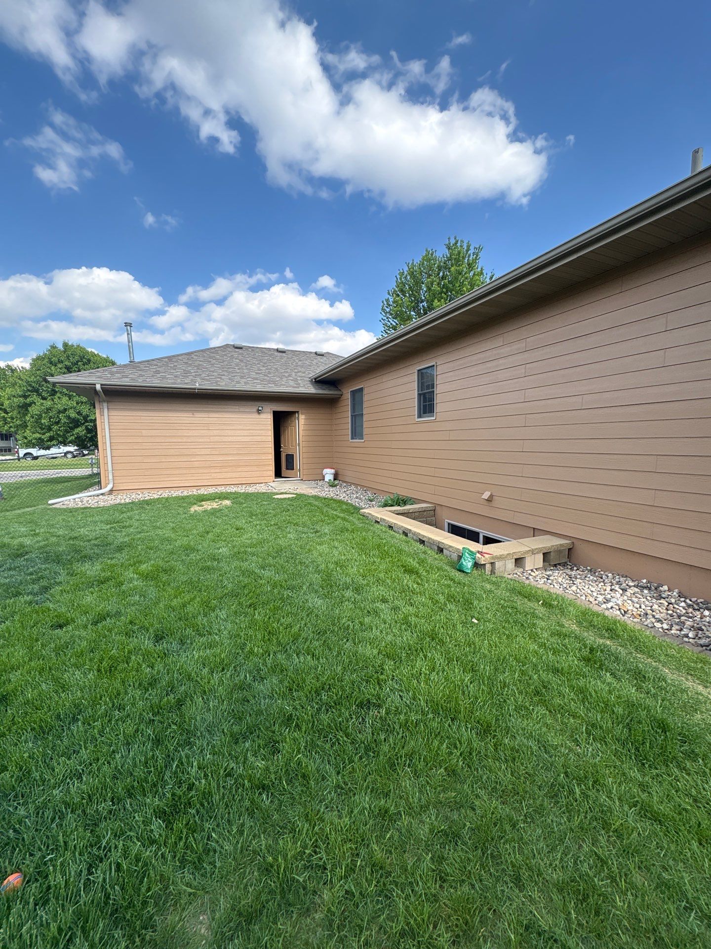 Sioux Falls Residential Exterior Door and Siding Refresh by Select Painting, Coatings & Garage Cabinets