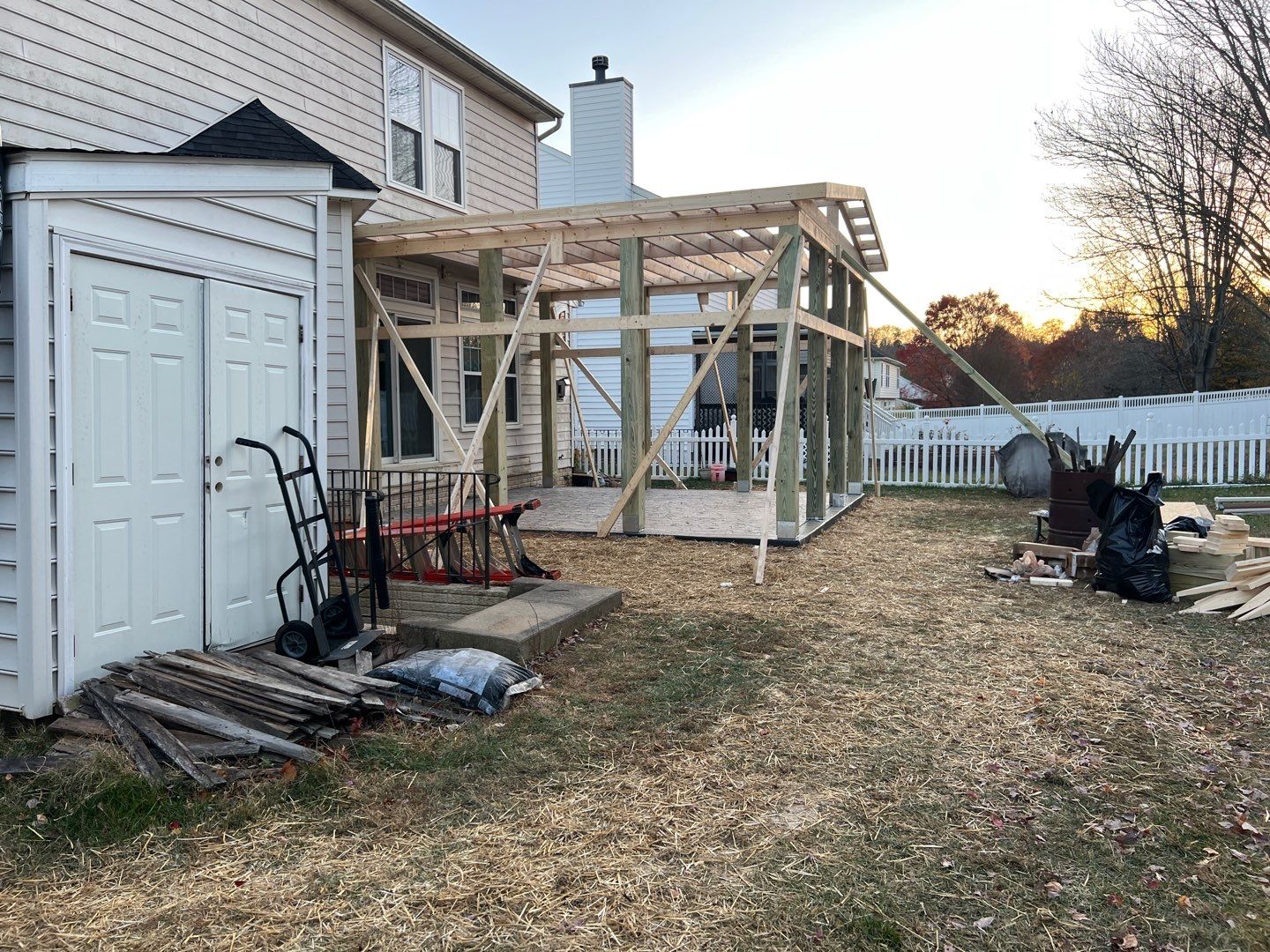 Custom Screened-In Porch with Stamped Concrete Patio in Warrenton by Jakari Restoration & Construction LLC