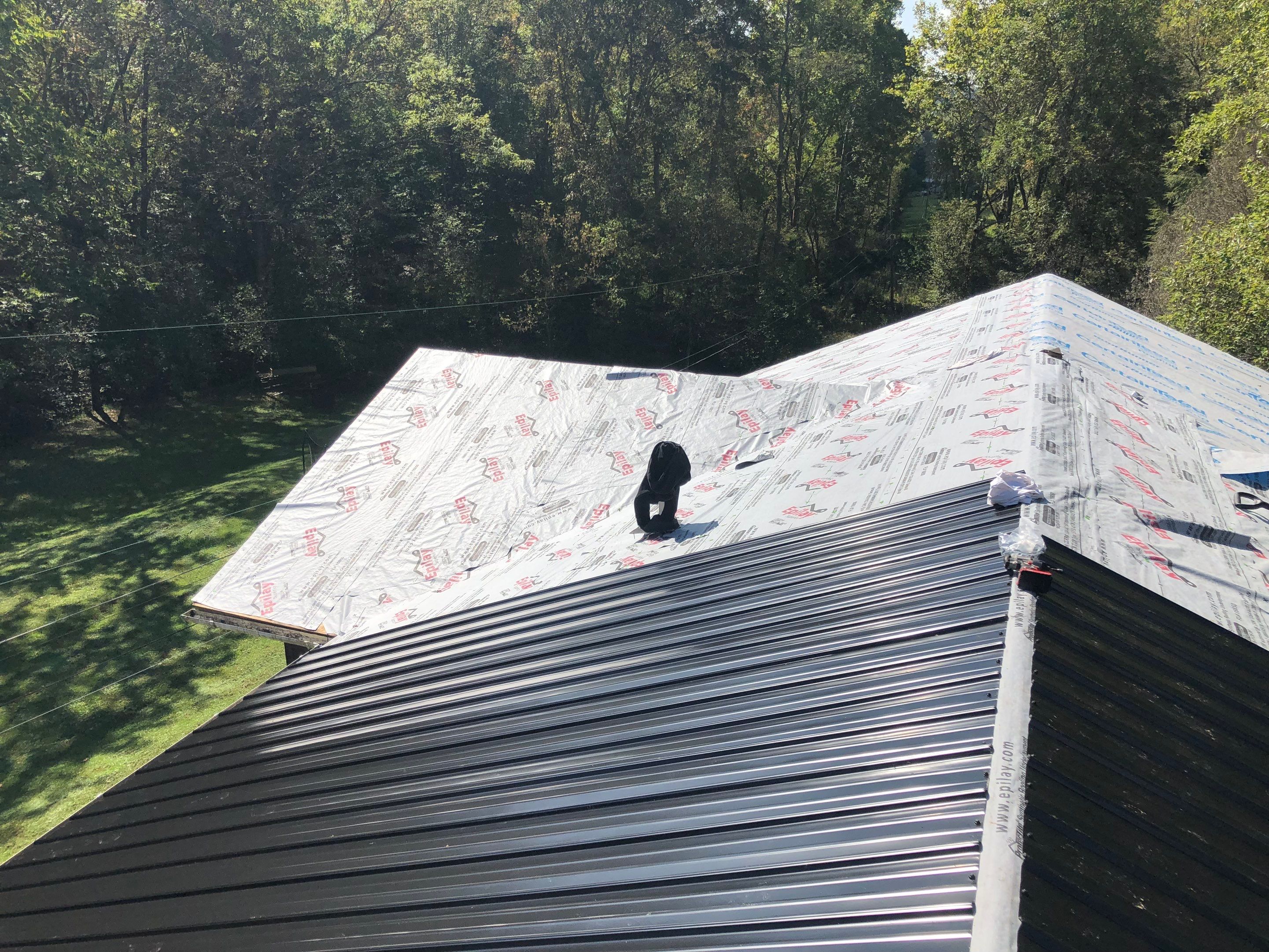 Metal Roof and Vinyl Siding, Soffit, Gutters using LifeTite Premium metal roofing  by Secure Construction Company Inc