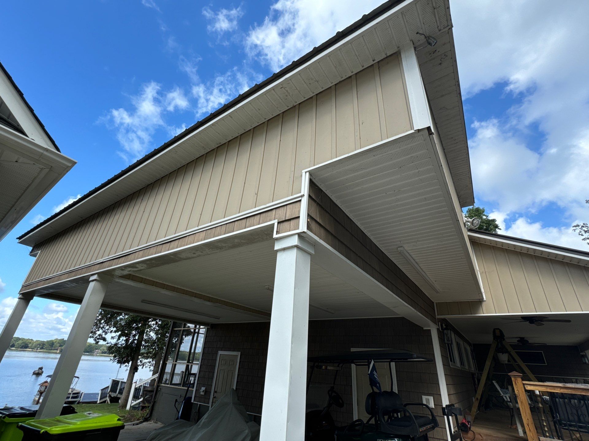 the service shown is cleaning the exterior siding and eaves of a house to remove dirt and grime