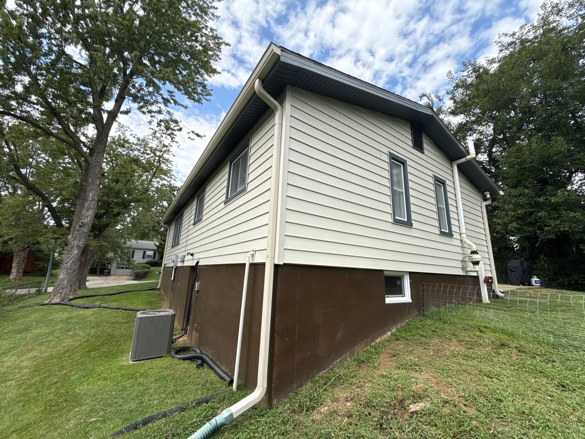 Complete Exterior Transformation With Craneboard Siding and Heartland Windows by EEC Windows, Siding & Roofing