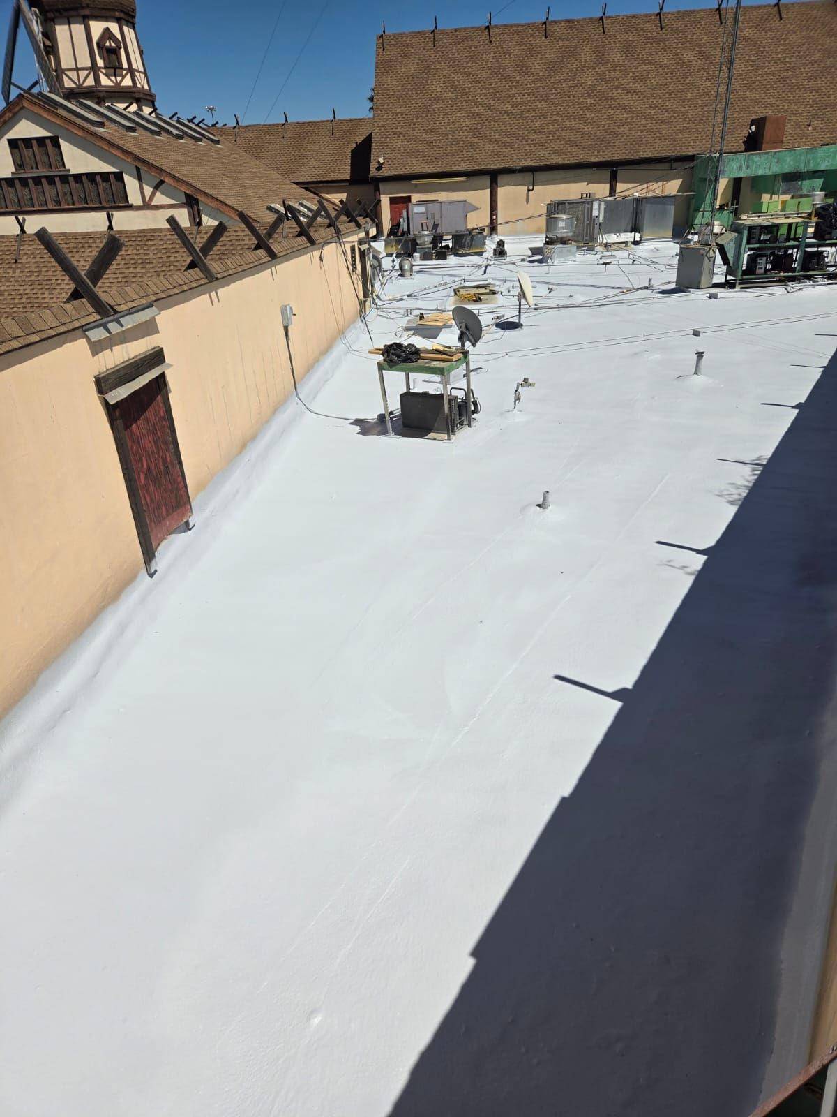 Spray foam and coatings using General Coatings acrylic coatings and spray foam by Straight Edge Roofing Inc