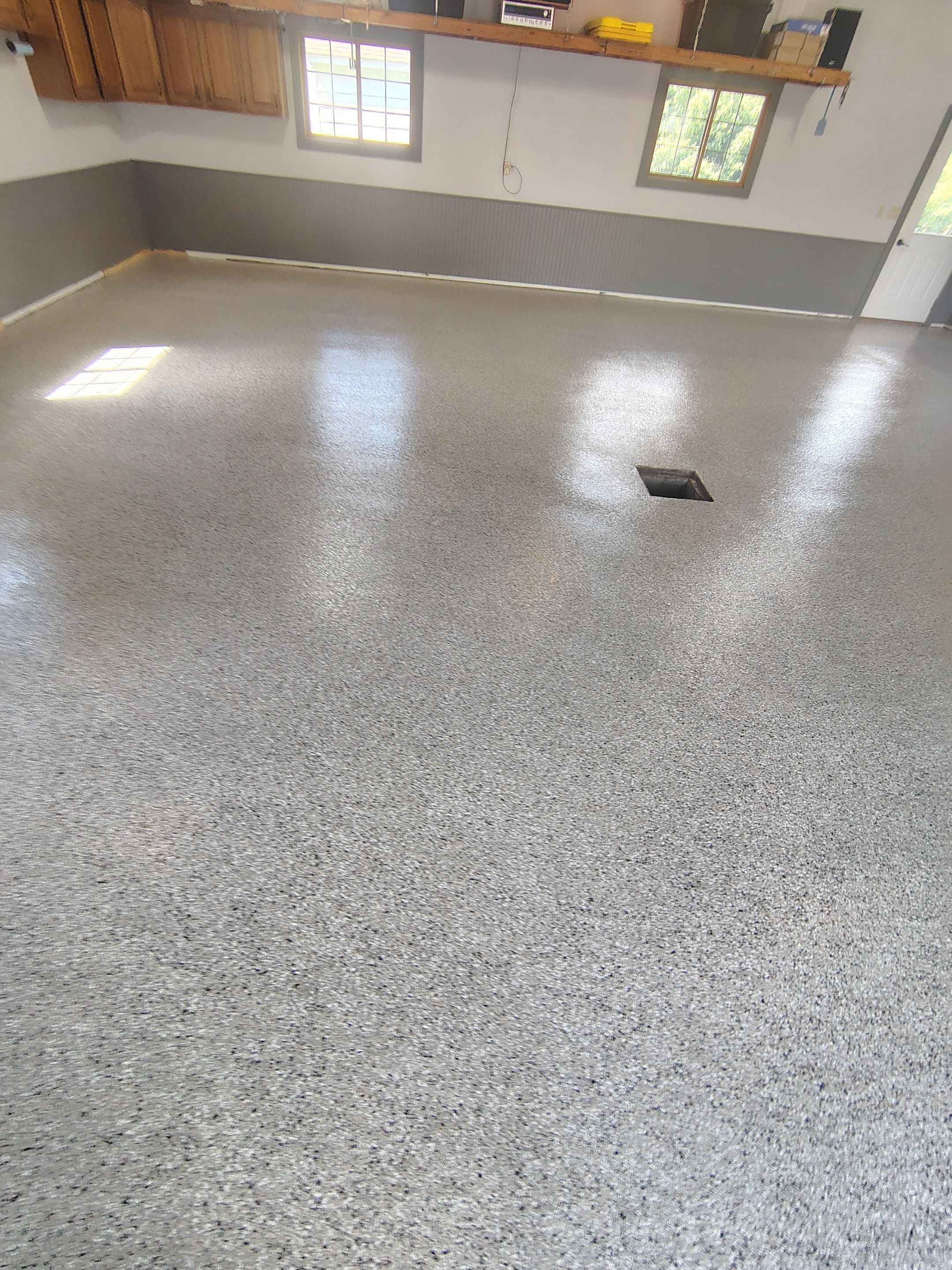 Multi-Fleck Epoxy Garage Floor Coating in Dell Rapids by Select Painting, Coatings & Garage Cabinets