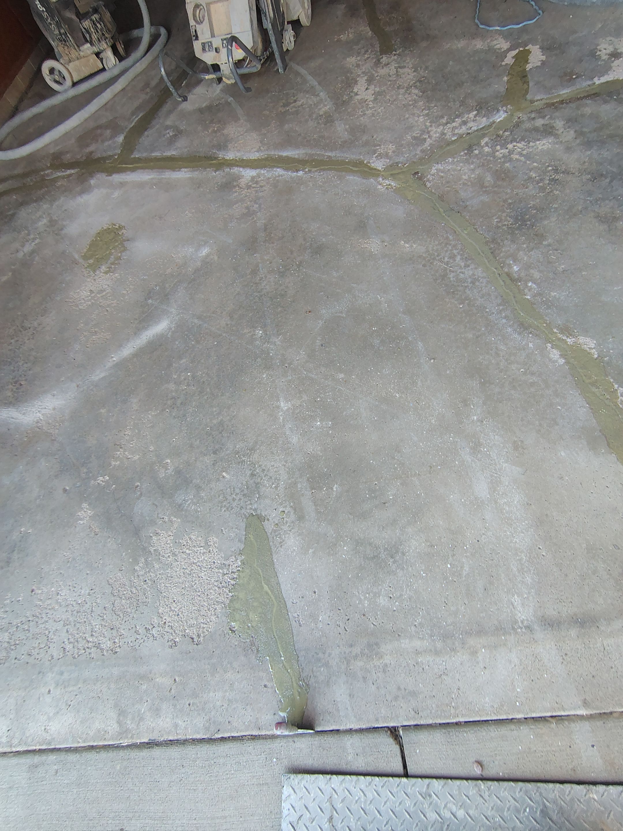 Sioux Falls Garage Epoxy Floor Installation and Concrete Crack Repair by Select Painting, Coatings & Garage Cabinets