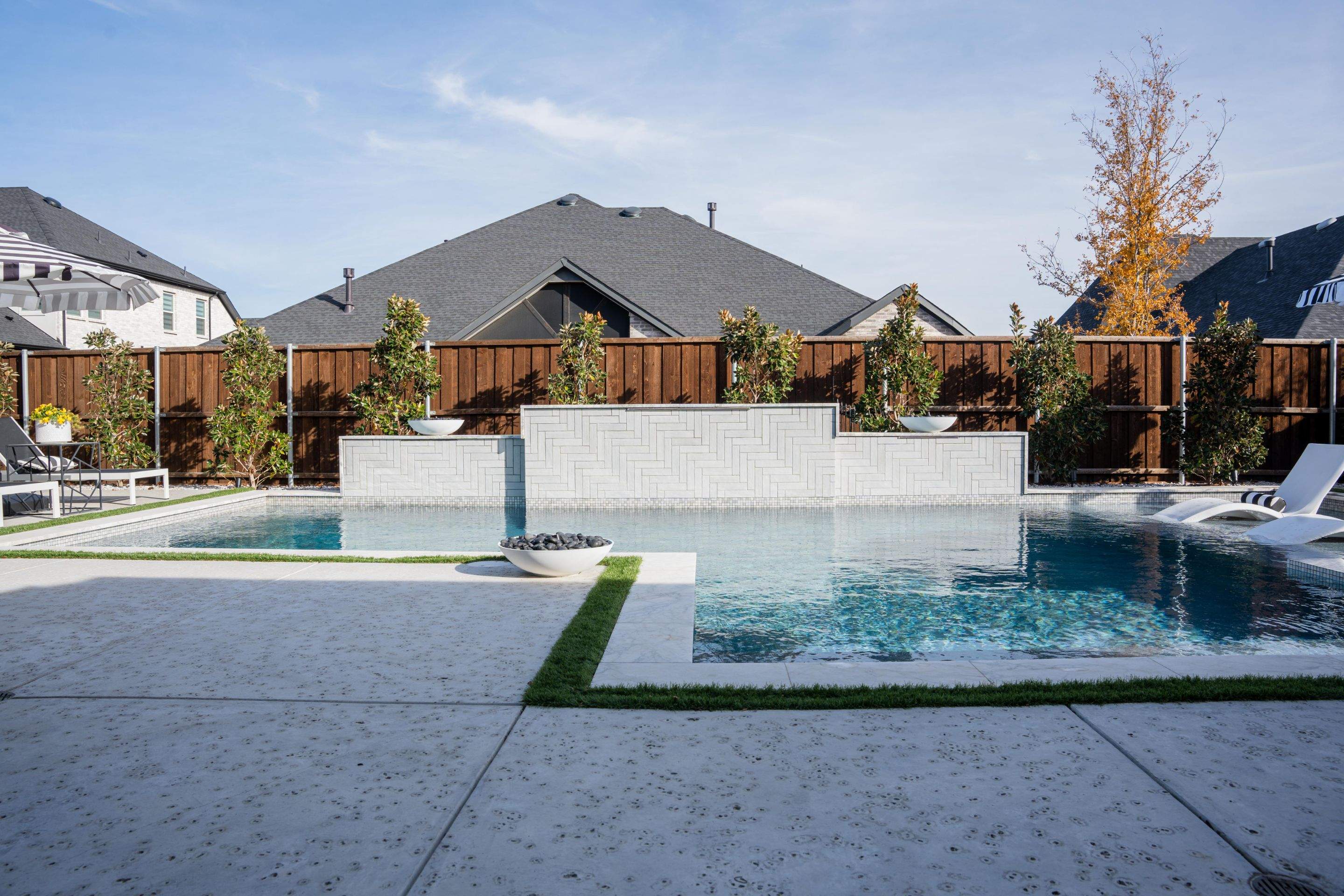 Pool with Large Sun Shelf and Spa by Pinnacle Pools and Spas - DFW