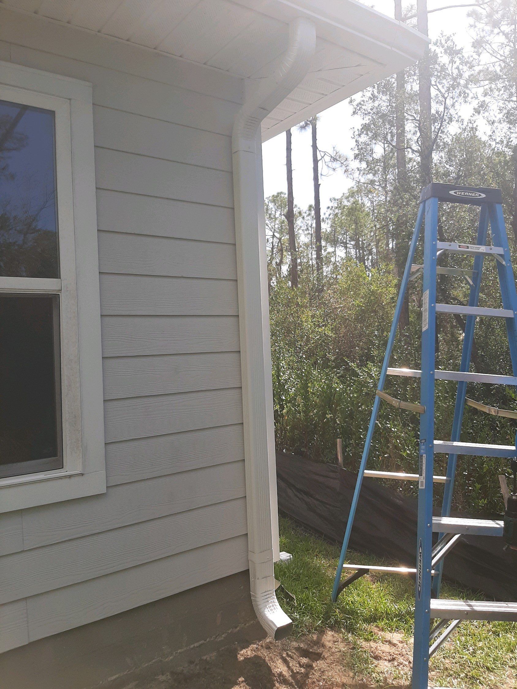 Seamless Gutter Installation using White by Gutter Professors