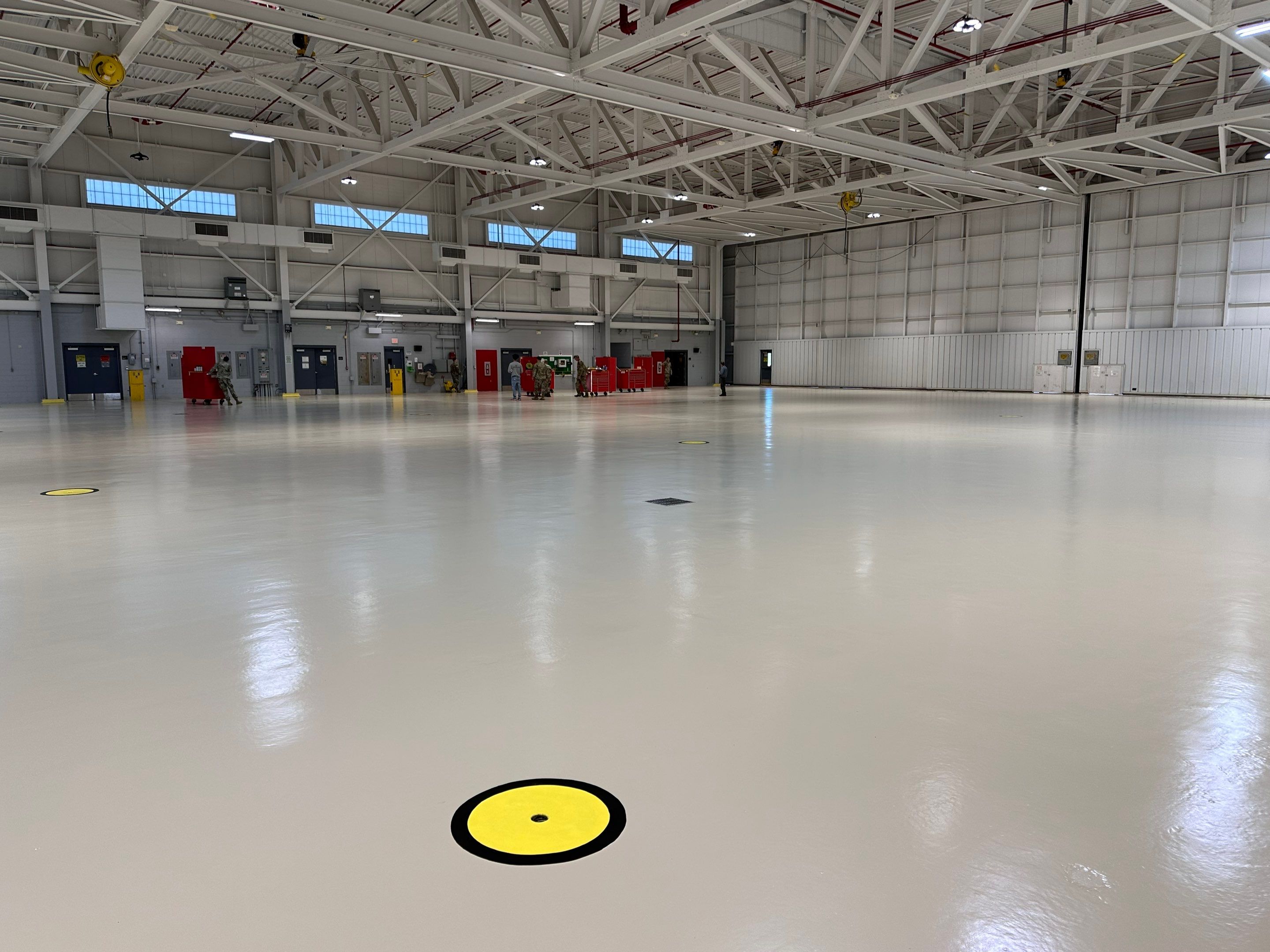 Industrial Epoxy Flooring for Army National Guard Hangar in Mobile by Cornerstone Hard Surface Restoration 