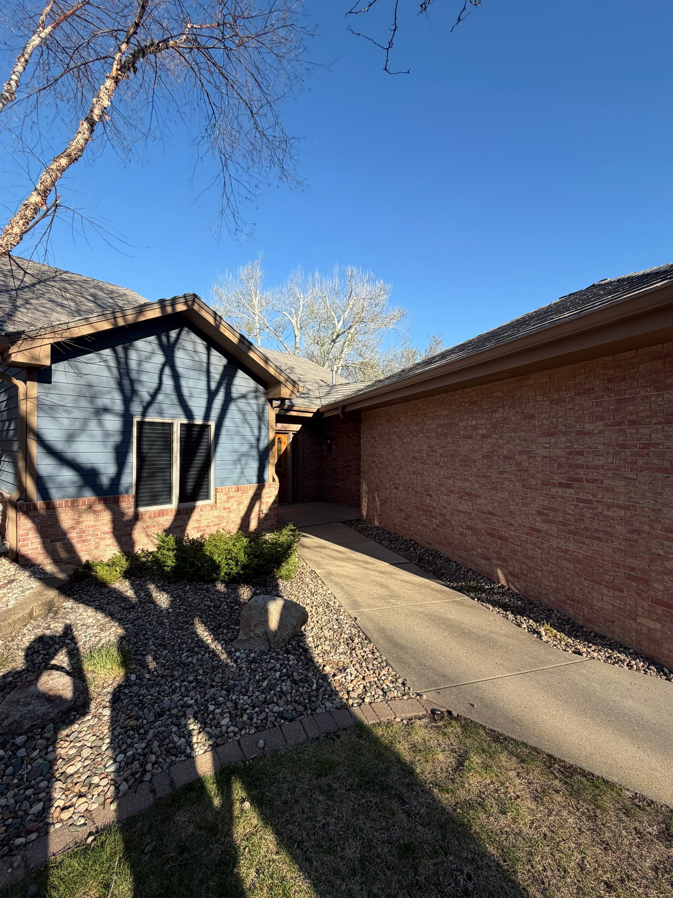 Residential Exterior Painting and Siding Refresh in Sioux Falls by Select Painting, Coatings & Garage Cabinets