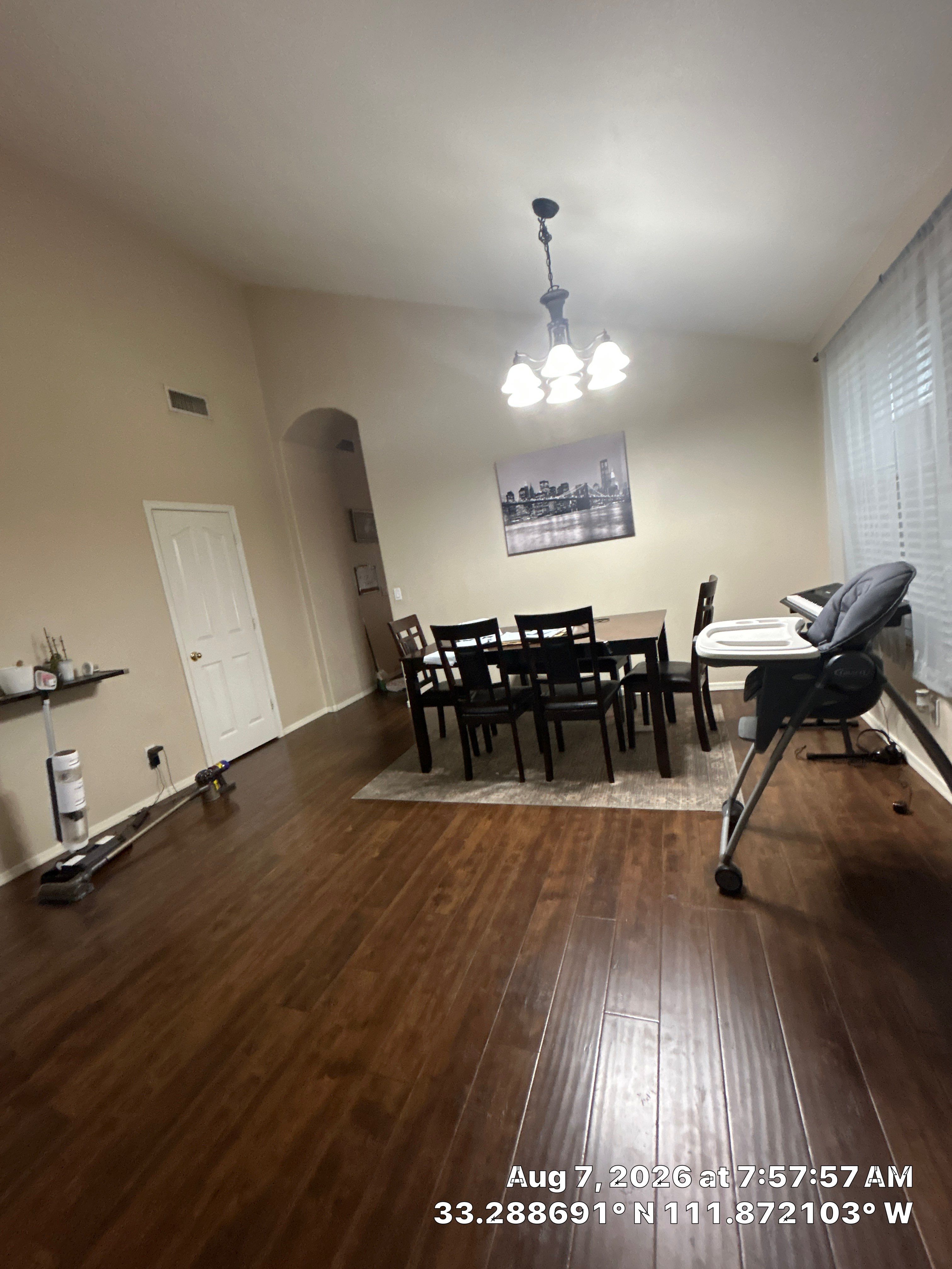 Modern Dining Room Renovation With Dark Wood Floors and Lighting by CompanyCam Sales Demo