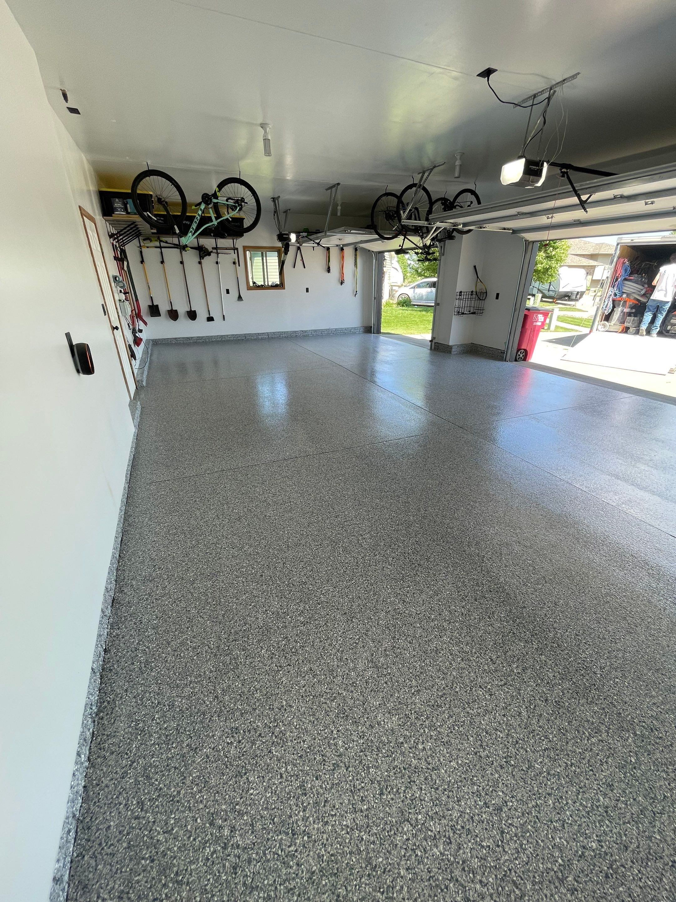 Tidal Wave Flake Garage Floor Installation in Sioux Falls by Select Painting, Coatings & Garage Cabinets